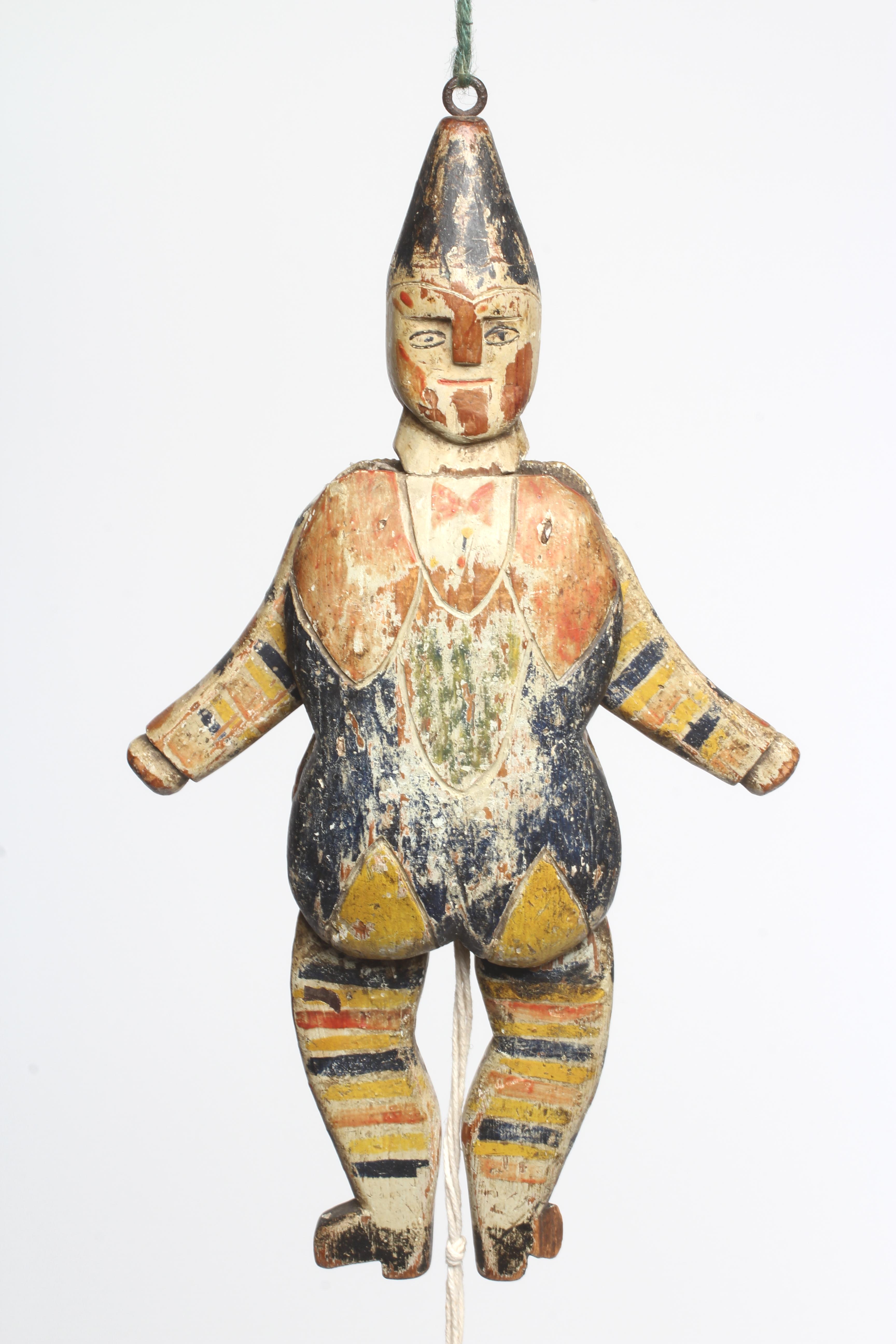 A folk art carved and painted wood jumping jack, double sided and with hinged shoulders and hips, 14 Image