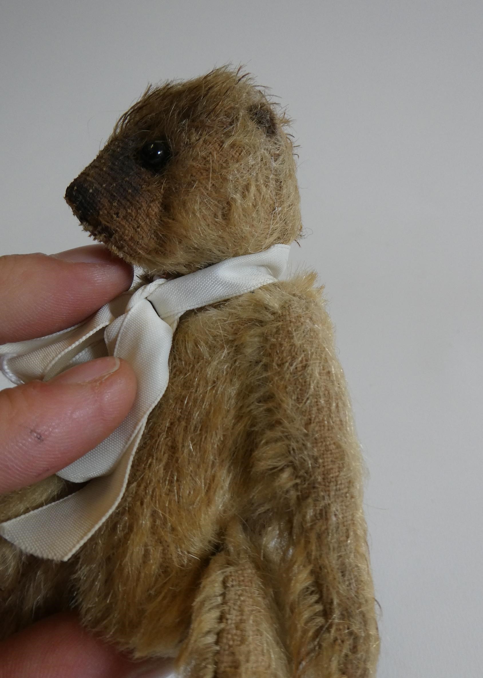 Soldier bear, with one button eye and one sewn, light orange plush, jointed neck, shoulders and Image