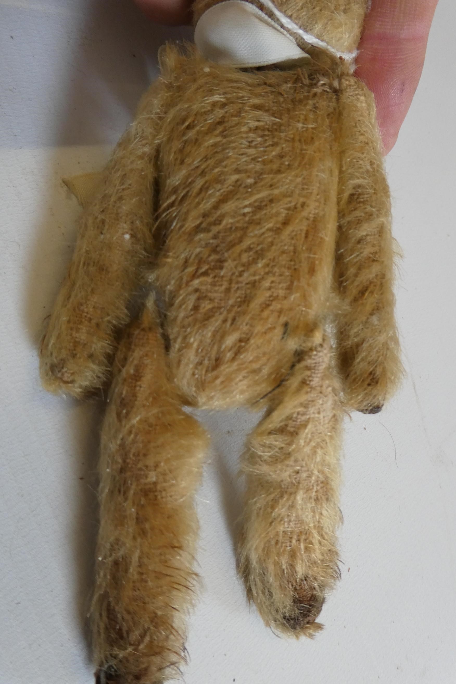 Soldier bear, with one button eye and one sewn, light orange plush, jointed neck, shoulders and Image