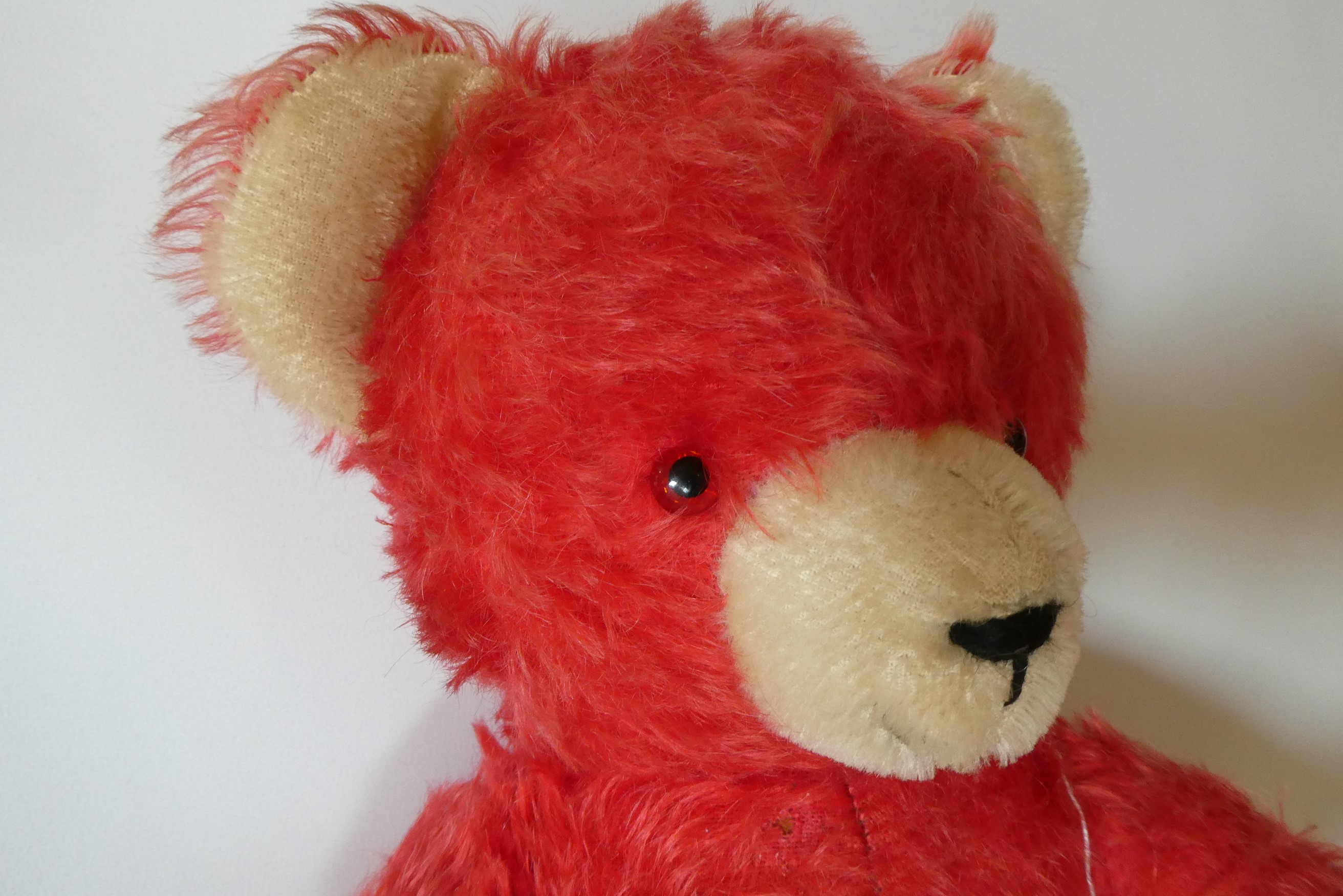 German red jointed teddy bear, with glass eyes, sewn nose, cream ears, nose and pads, 17" long (Est. Image