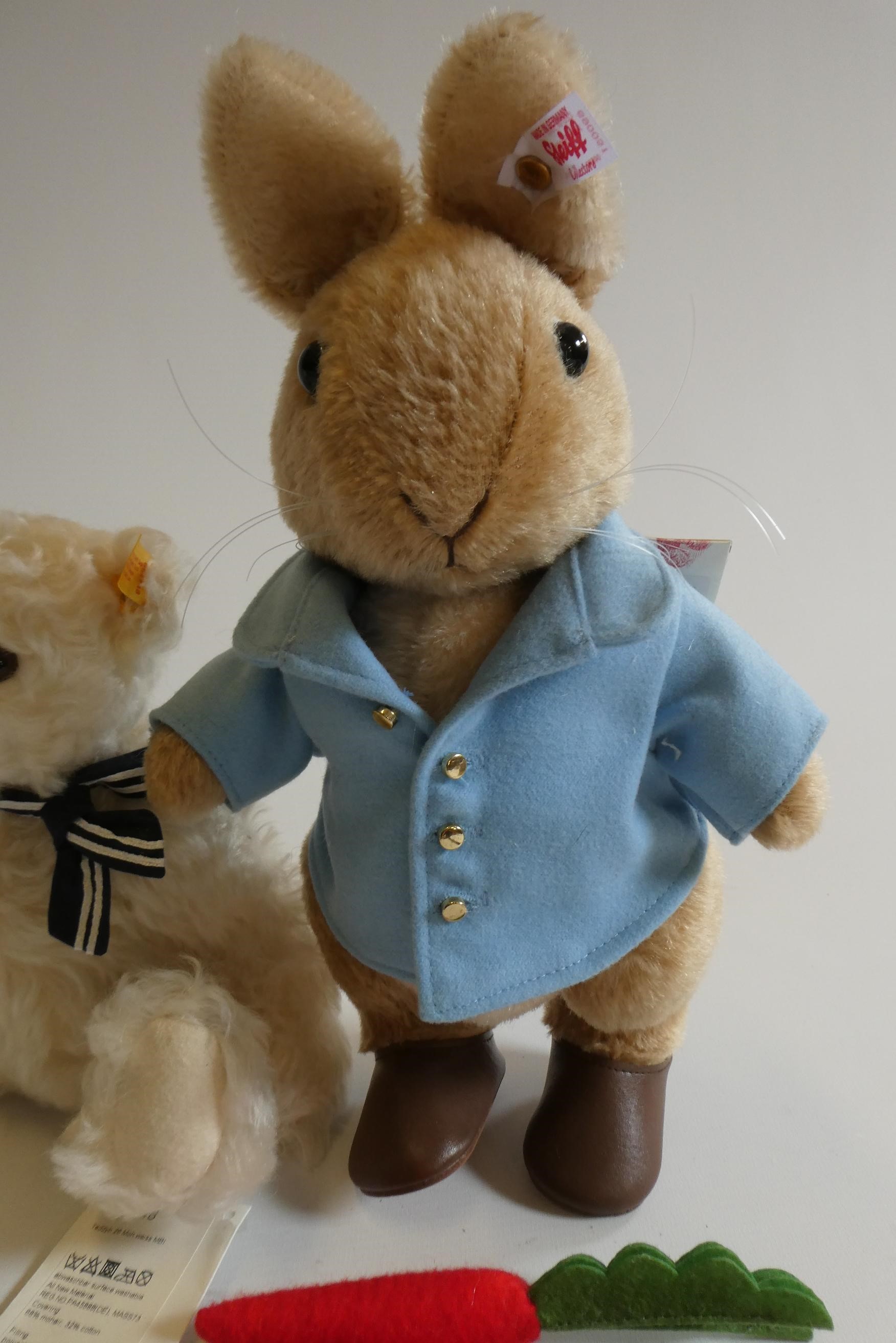 Three Steiff bears, comprising a 12 1/2" Peter Rabbit with two carrots, 12 1/2" white Christmas bear Image