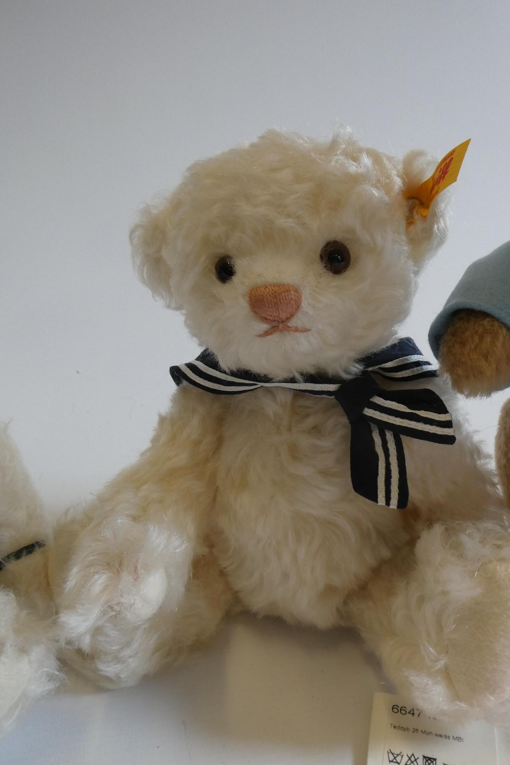 Three Steiff bears, comprising a 12 1/2" Peter Rabbit with two carrots, 12 1/2" white Christmas bear Image