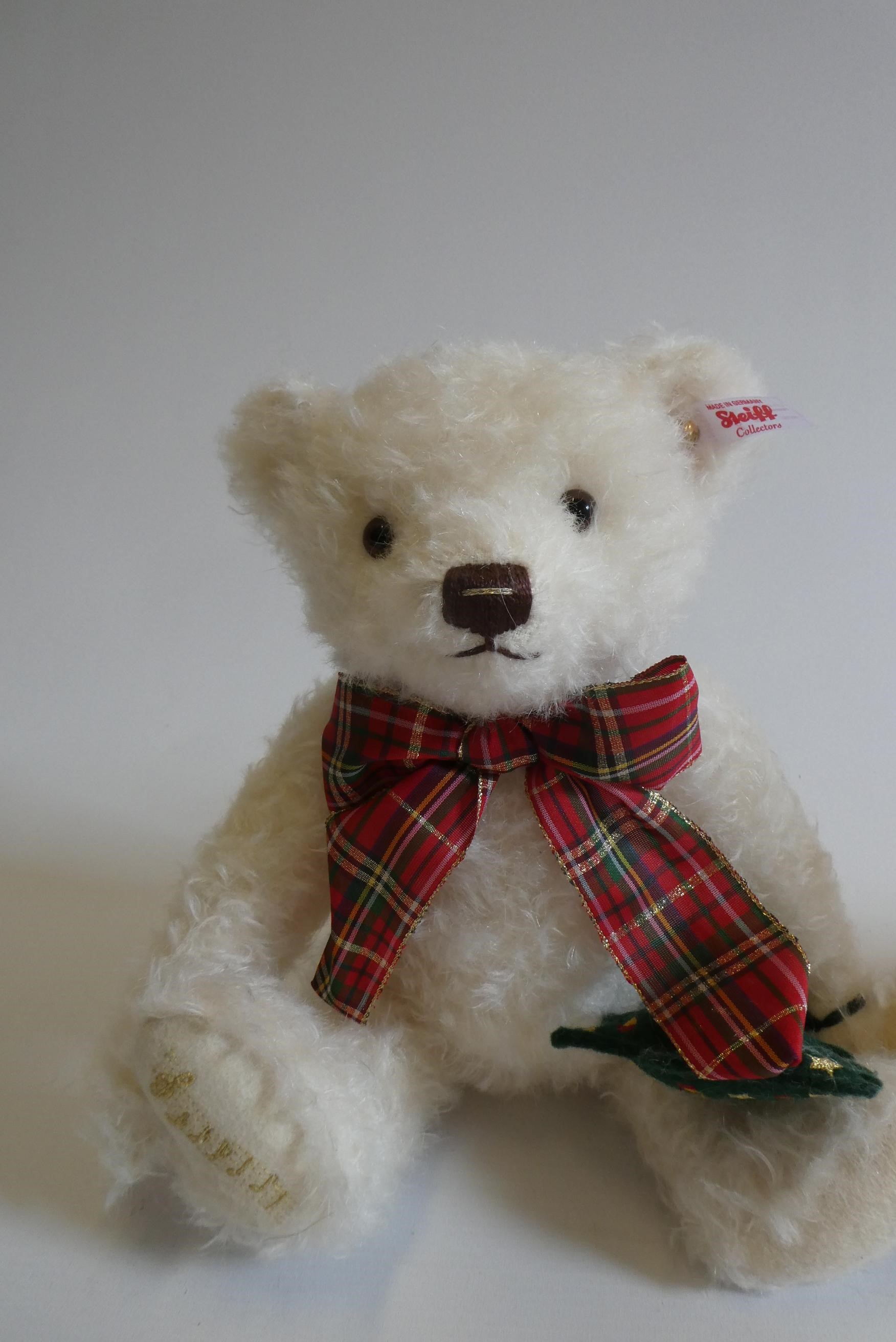 Three Steiff bears, comprising a 12 1/2" Peter Rabbit with two carrots, 12 1/2" white Christmas bear Image