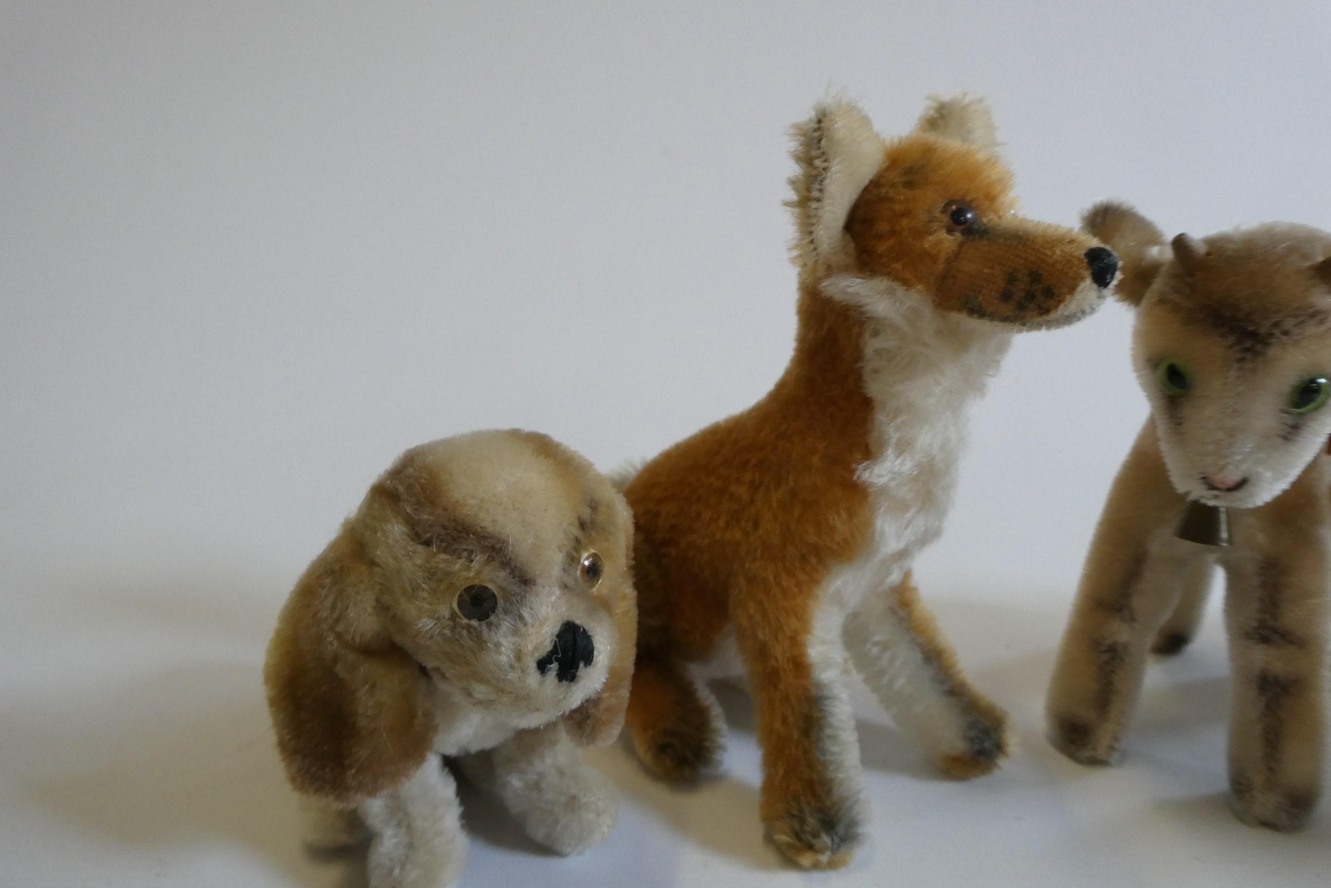 Five Steiff animals, comprising a fox, a goat, a puppy, a sheep and a lamb, largest 8" (Est. plus Image