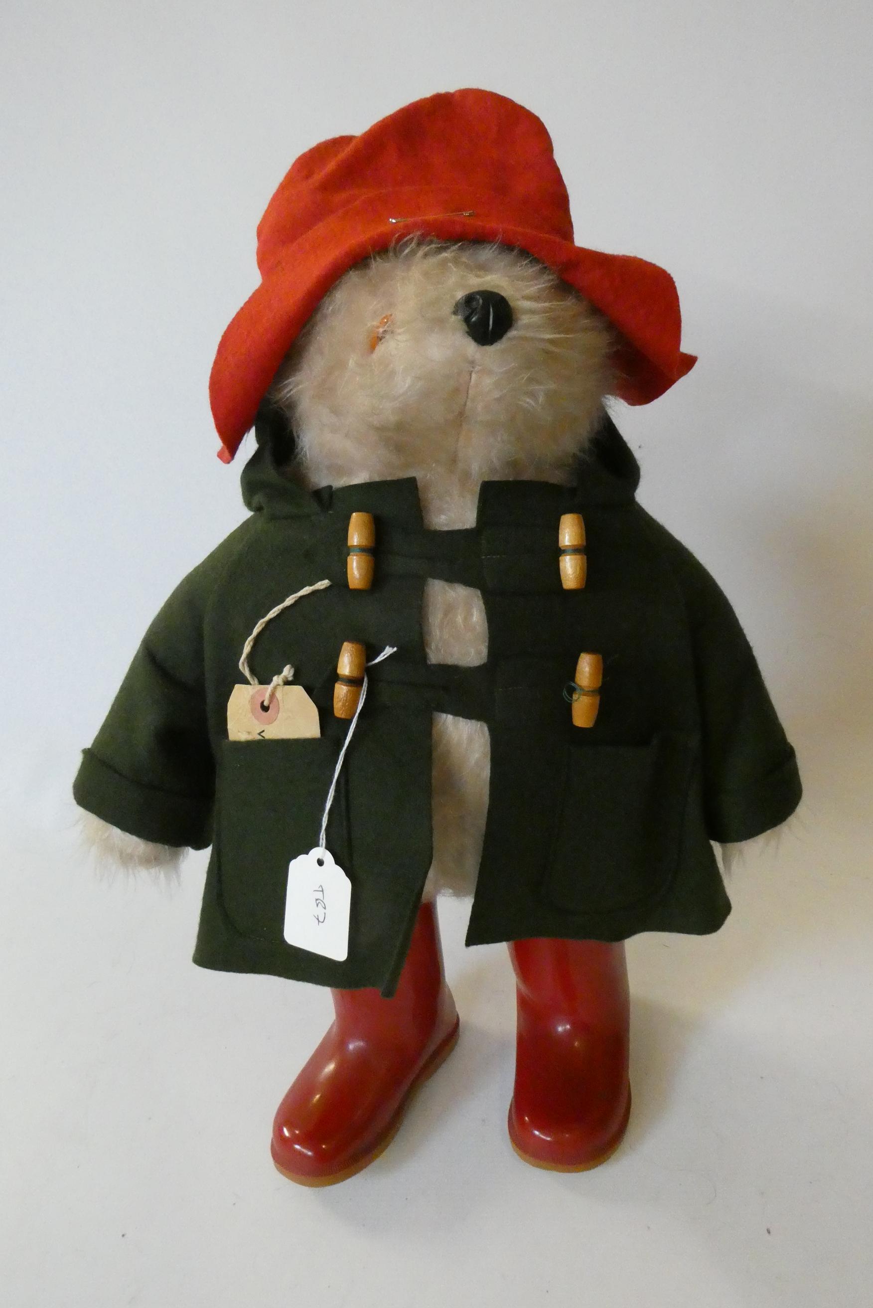 Vintage Paddington bear, with green felt coat, red felt hat, red Dunlop boots and tag, 18" (Est. Image