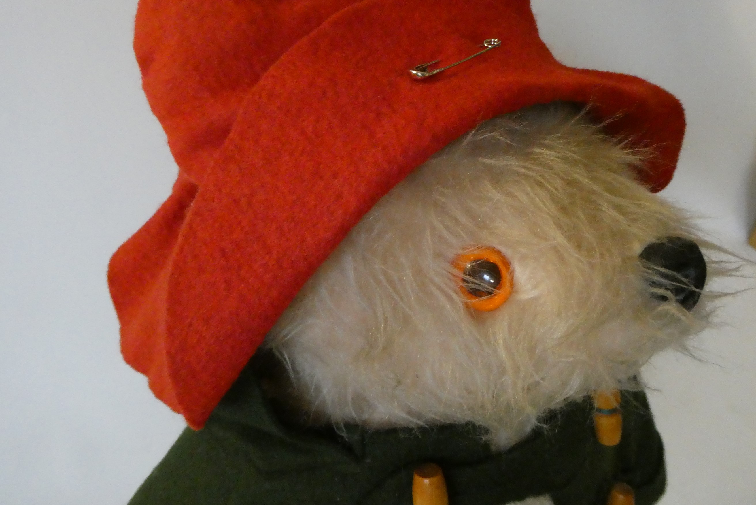 Vintage Paddington bear, with green felt coat, red felt hat, red Dunlop boots and tag, 18" (Est. Image