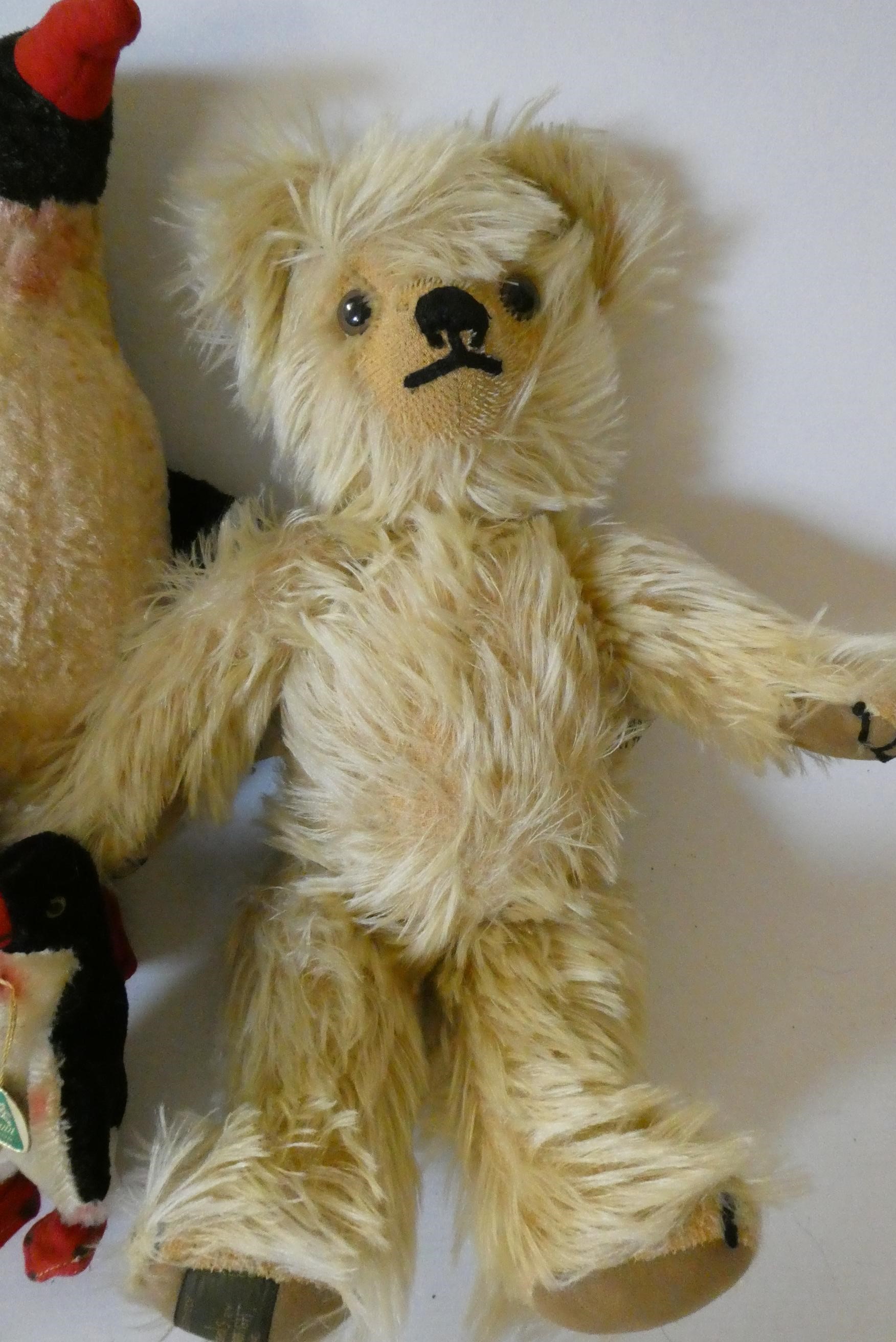 A family of Hermann Penguins, mum, dad, teenager and chick, two with original labels and all with Image