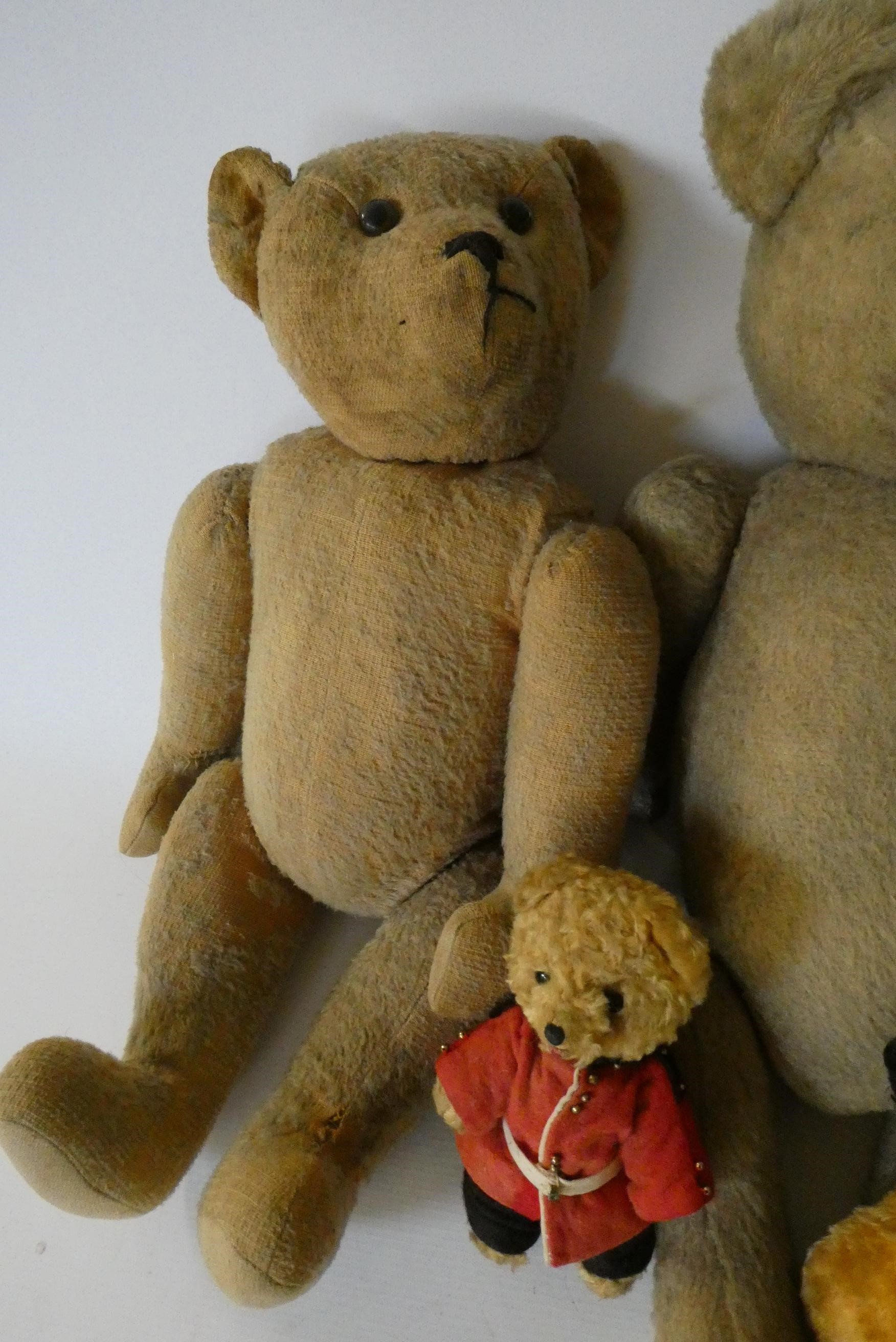 Seven vintage plush toys comprising three large teddy bears, one small soldier bear, two puppets Image