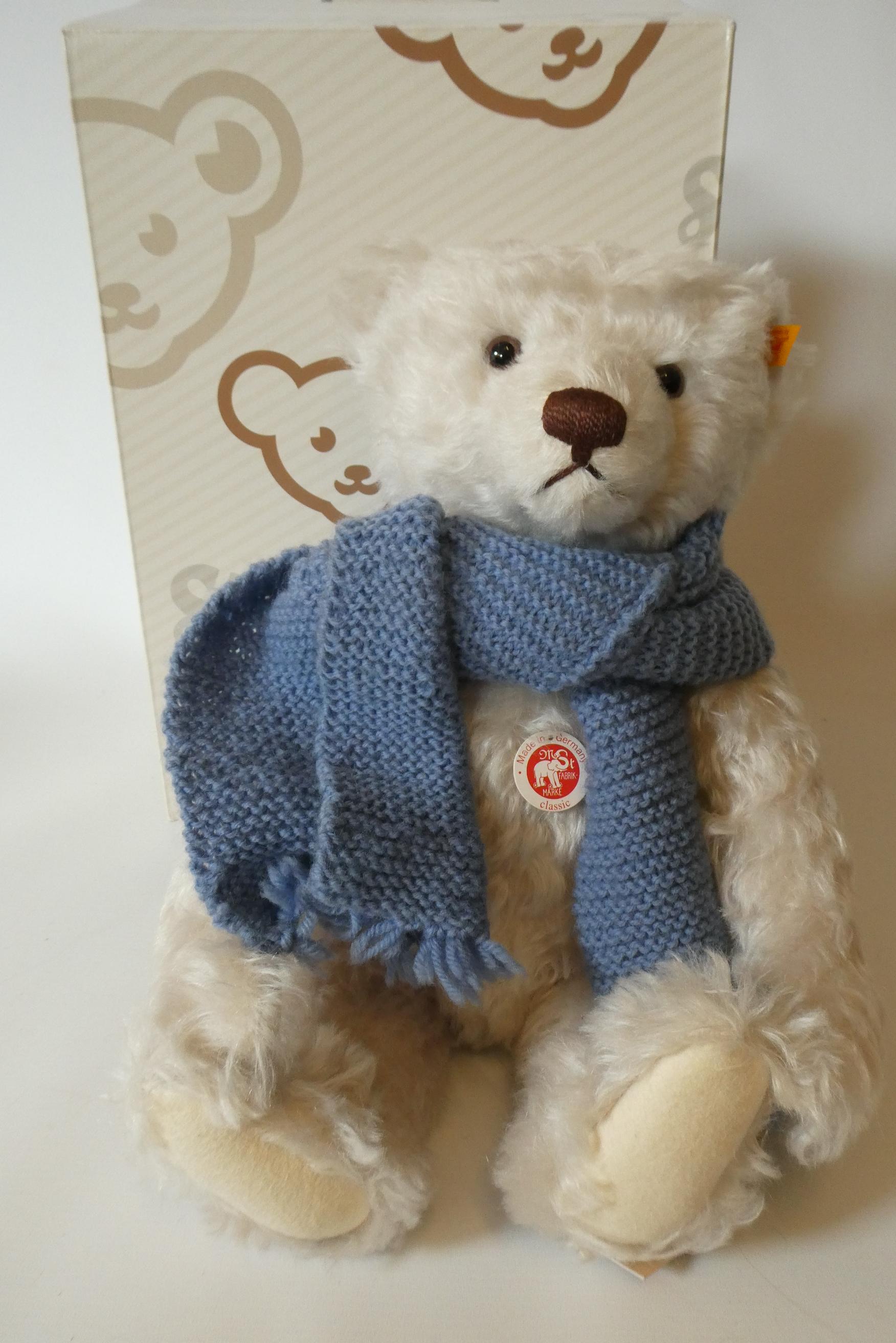 A Steiff Classic 42 pink teddy bear, with blue knitted scarf, labels and Steiff box (Est. plus 24% Image