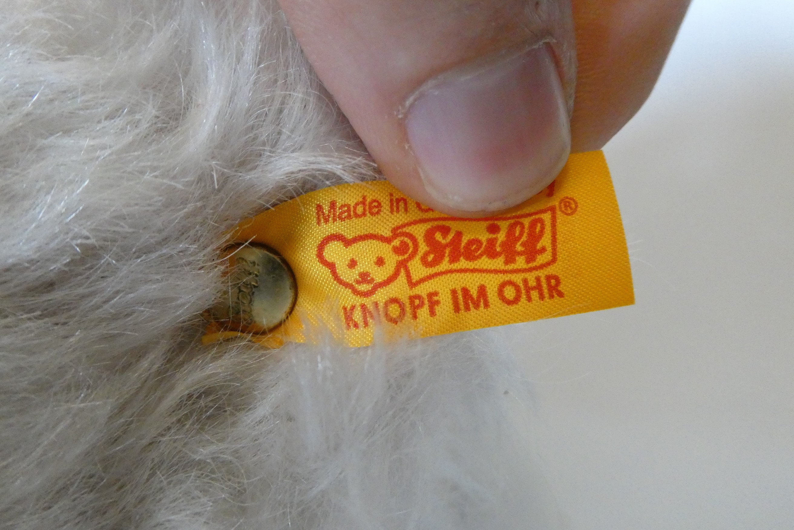 A Steiff Classic 42 pink teddy bear, with blue knitted scarf, labels and Steiff box (Est. plus 24% Image