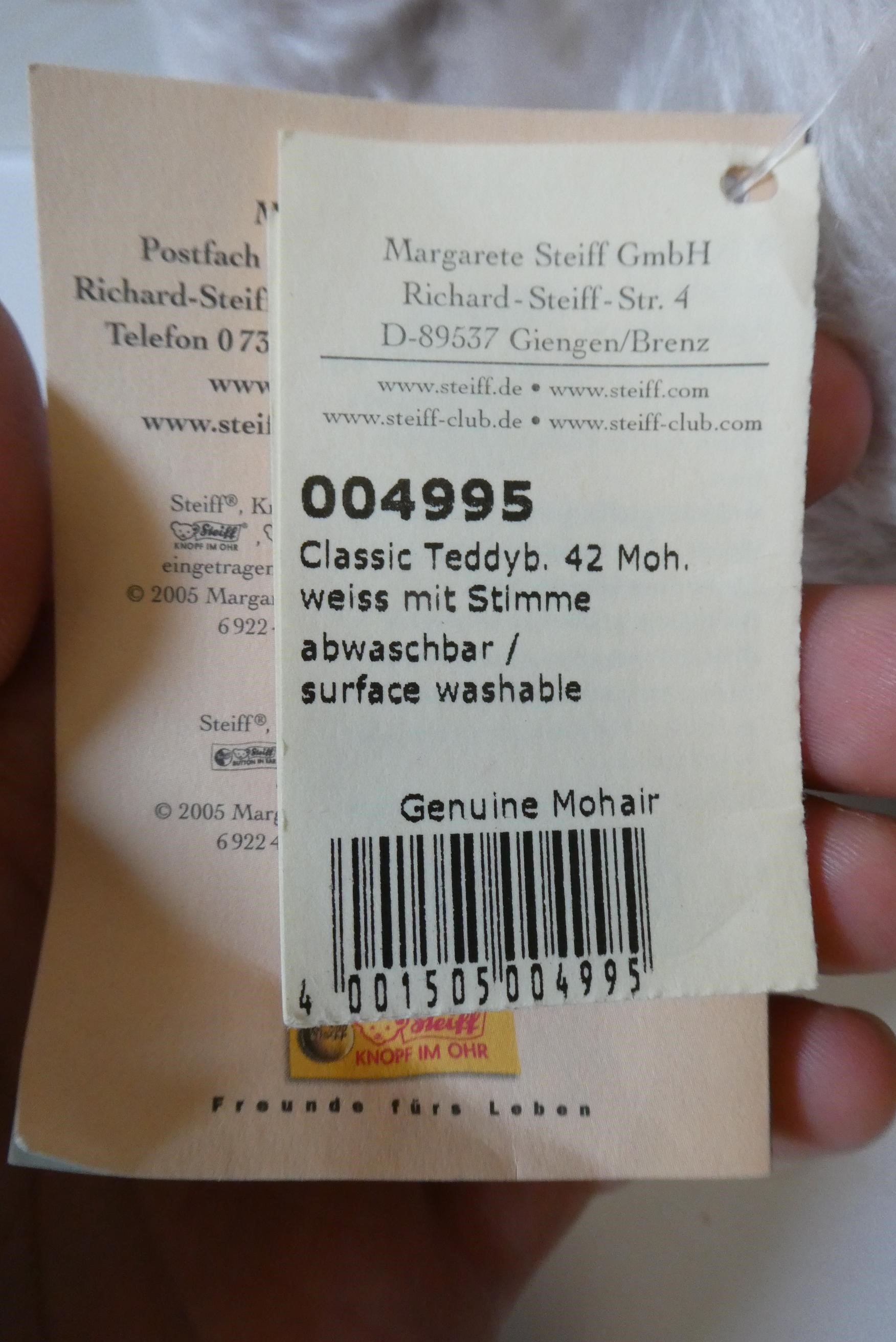 A Steiff Classic 42 pink teddy bear, with blue knitted scarf, labels and Steiff box (Est. plus 24% Image