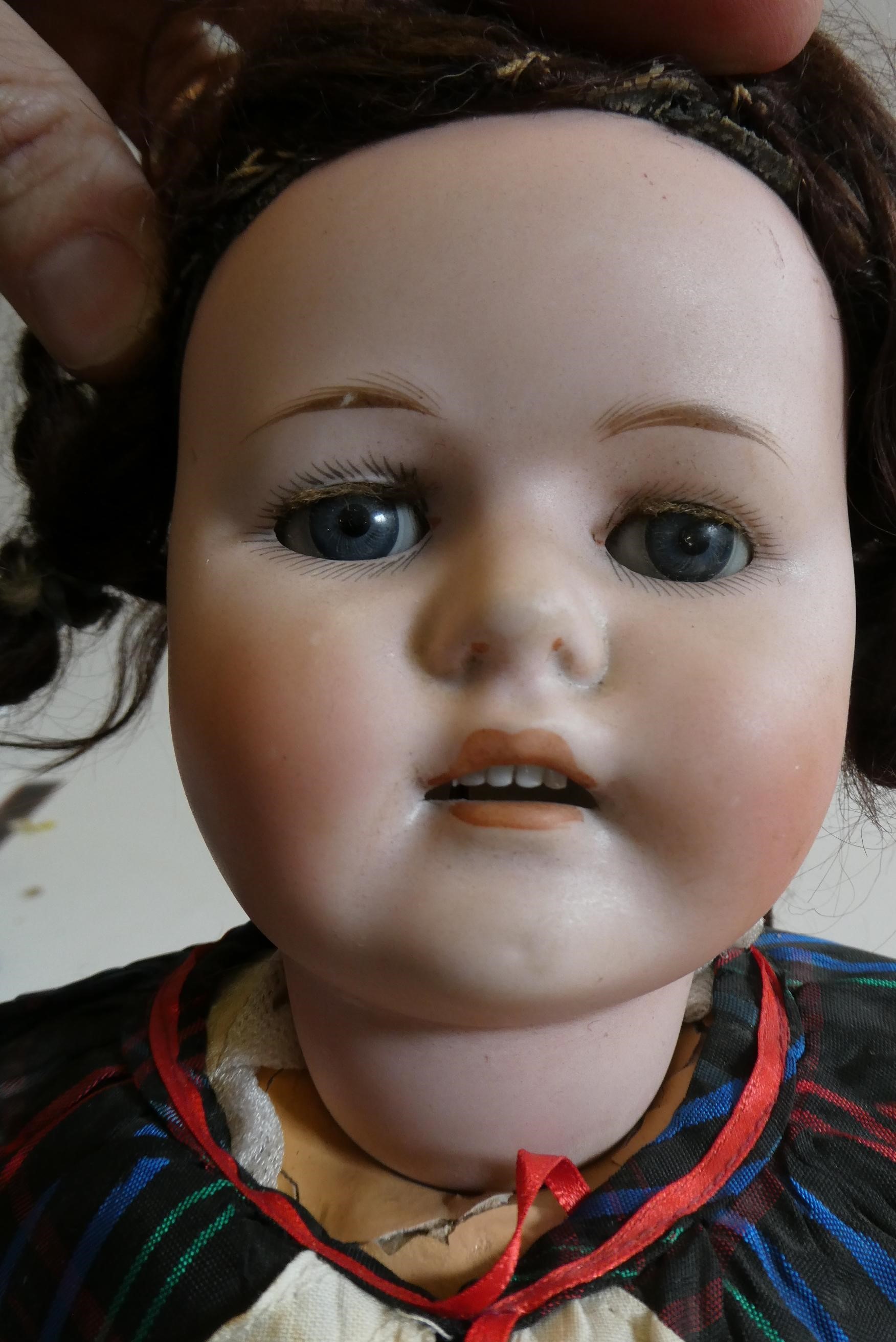 A Max Handwerk "Bebe Elite" bisque socket head doll with brown glass sleeping eyes Image