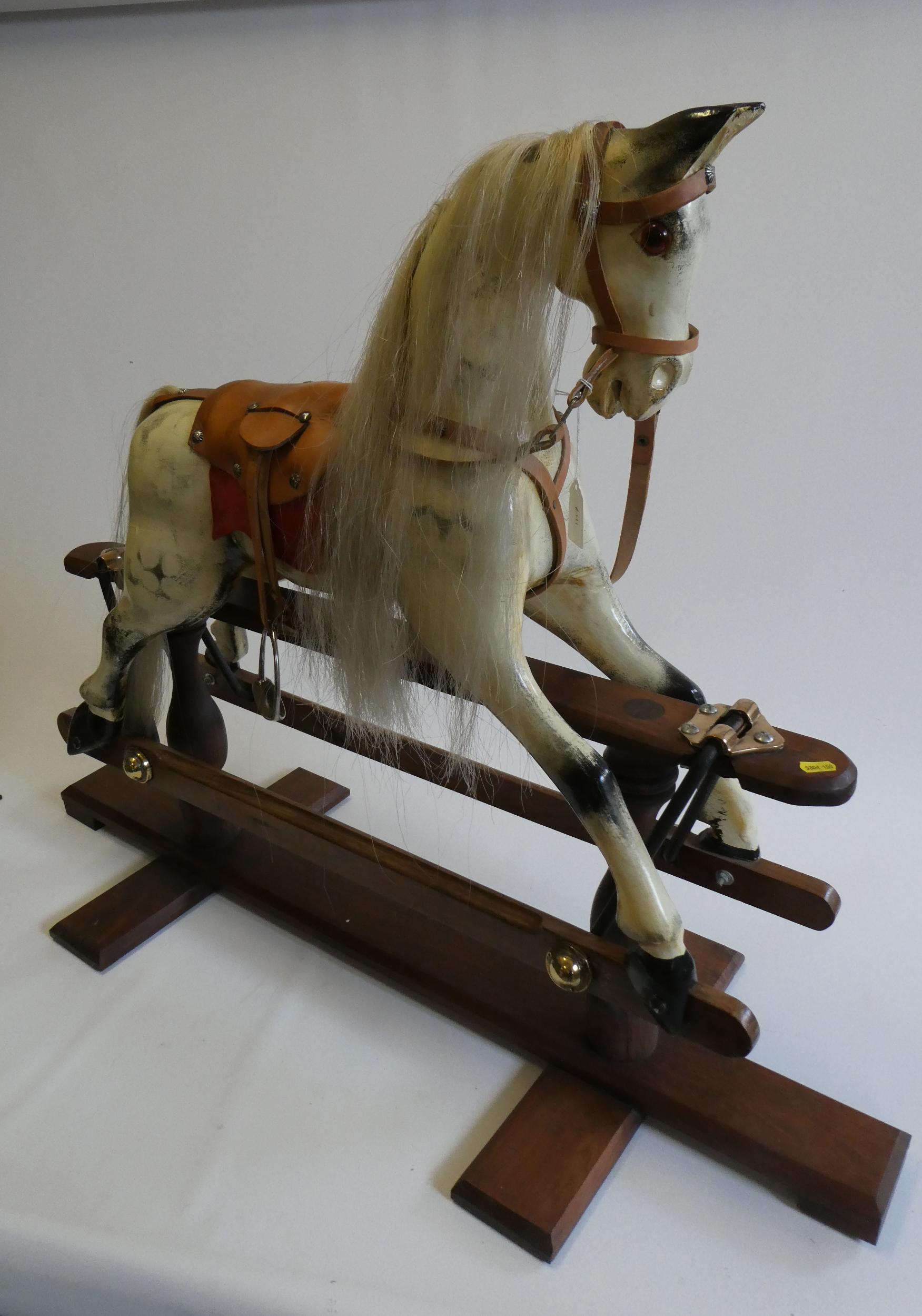 A dappled grey rocking horse Image