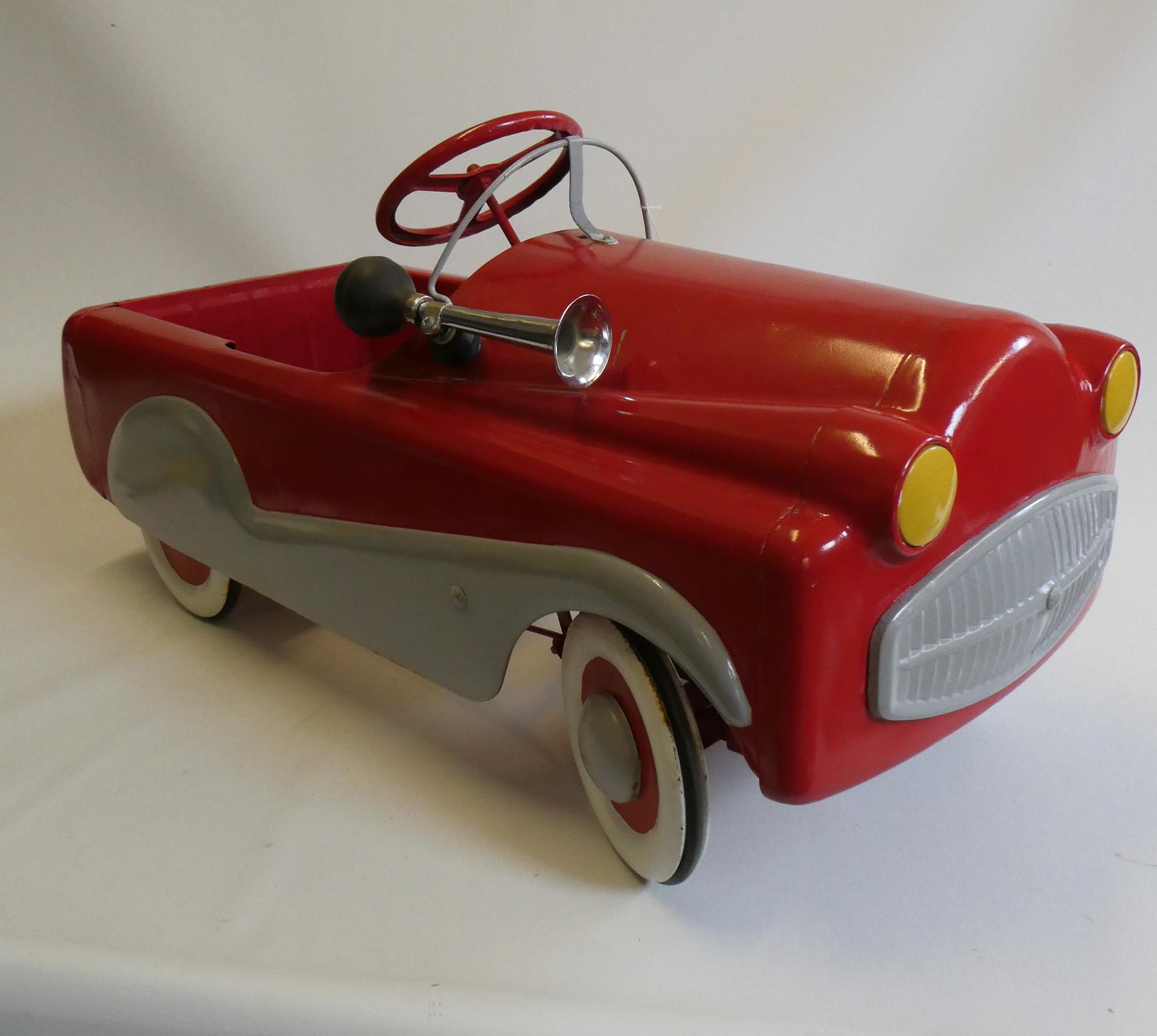 A Mobo pedal car, 1950s, with painted metal body, manual horn and wire windshield, 36" x 14 1/2", Image
