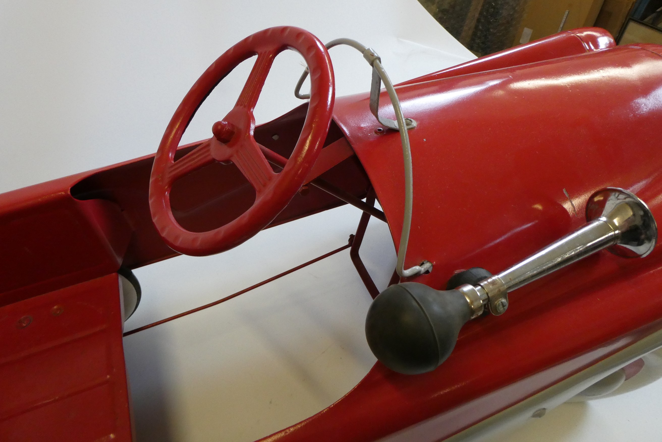 A Mobo pedal car, 1950s, with painted metal body, manual horn and wire windshield, 36" x 14 1/2", Image