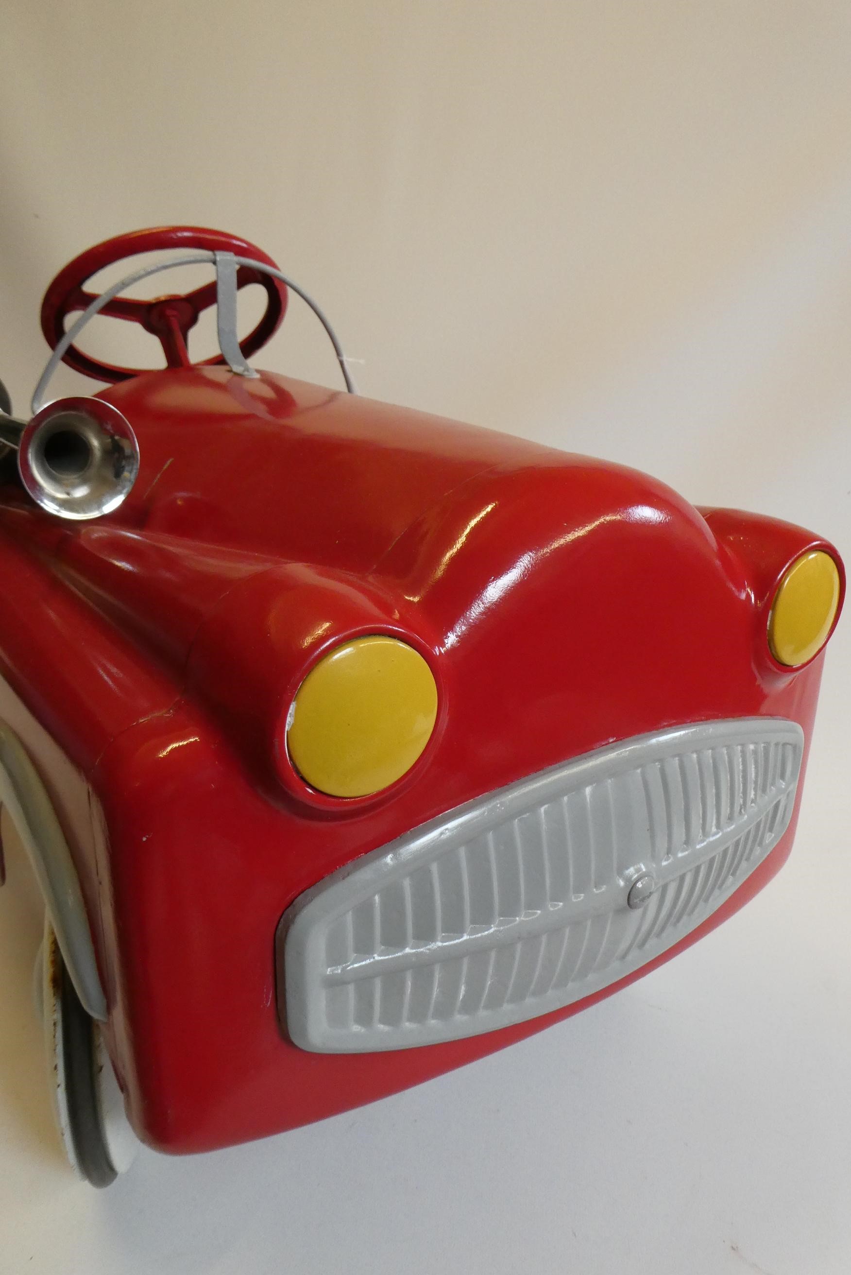 A Mobo pedal car, 1950s, with painted metal body, manual horn and wire windshield, 36" x 14 1/2", Image