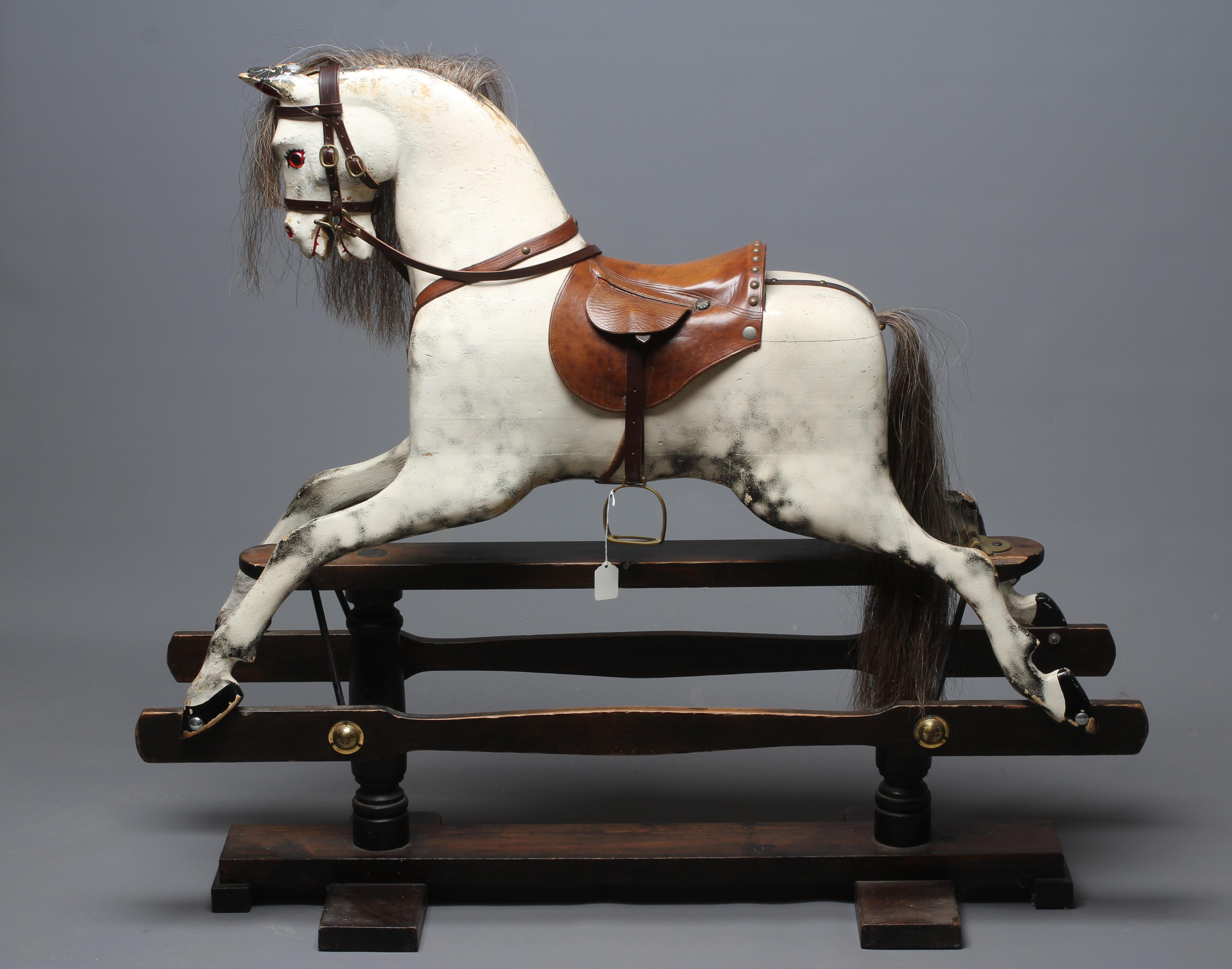 A dappled grey rocking horse Image