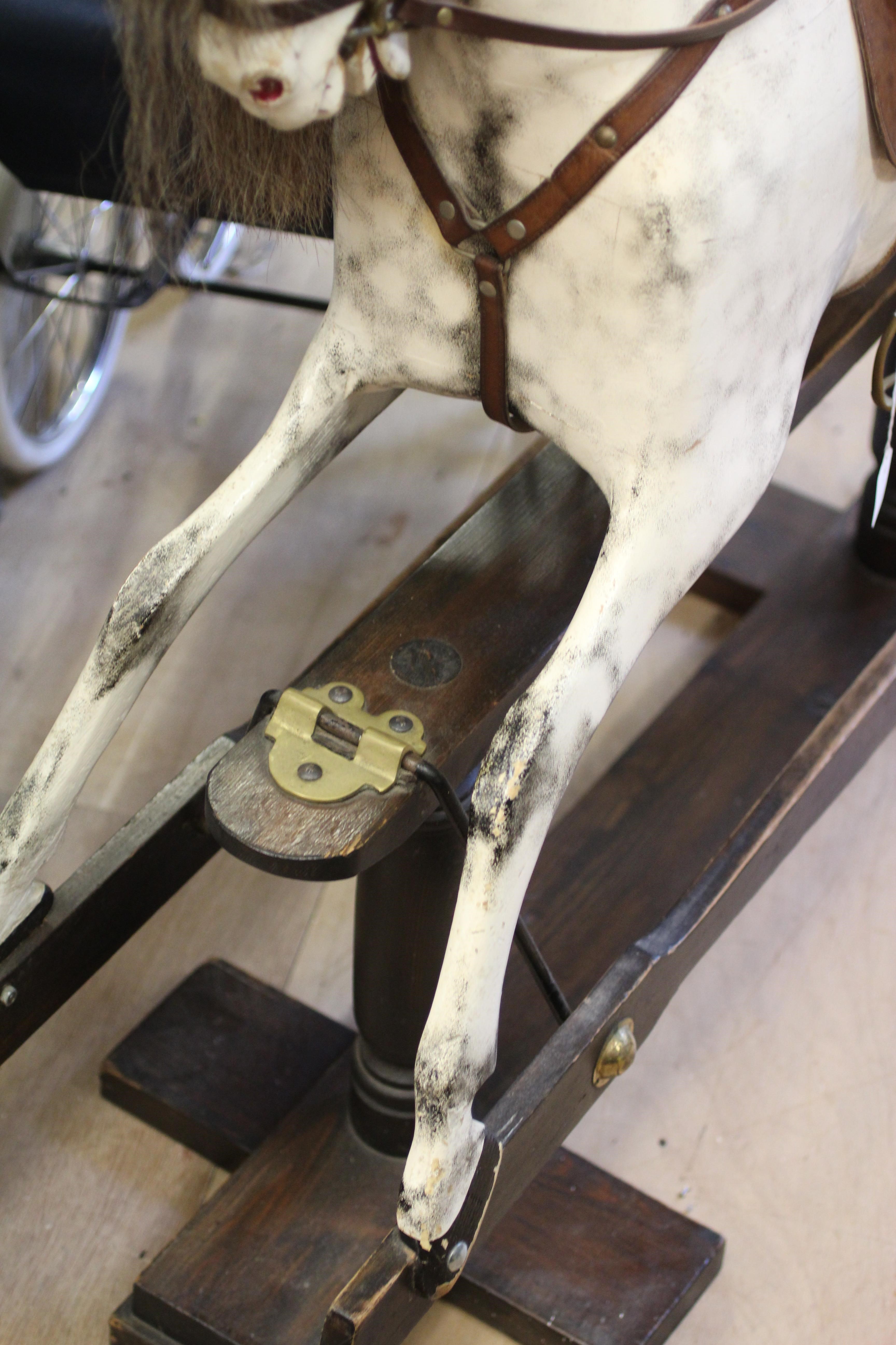 A dappled grey rocking horse Image