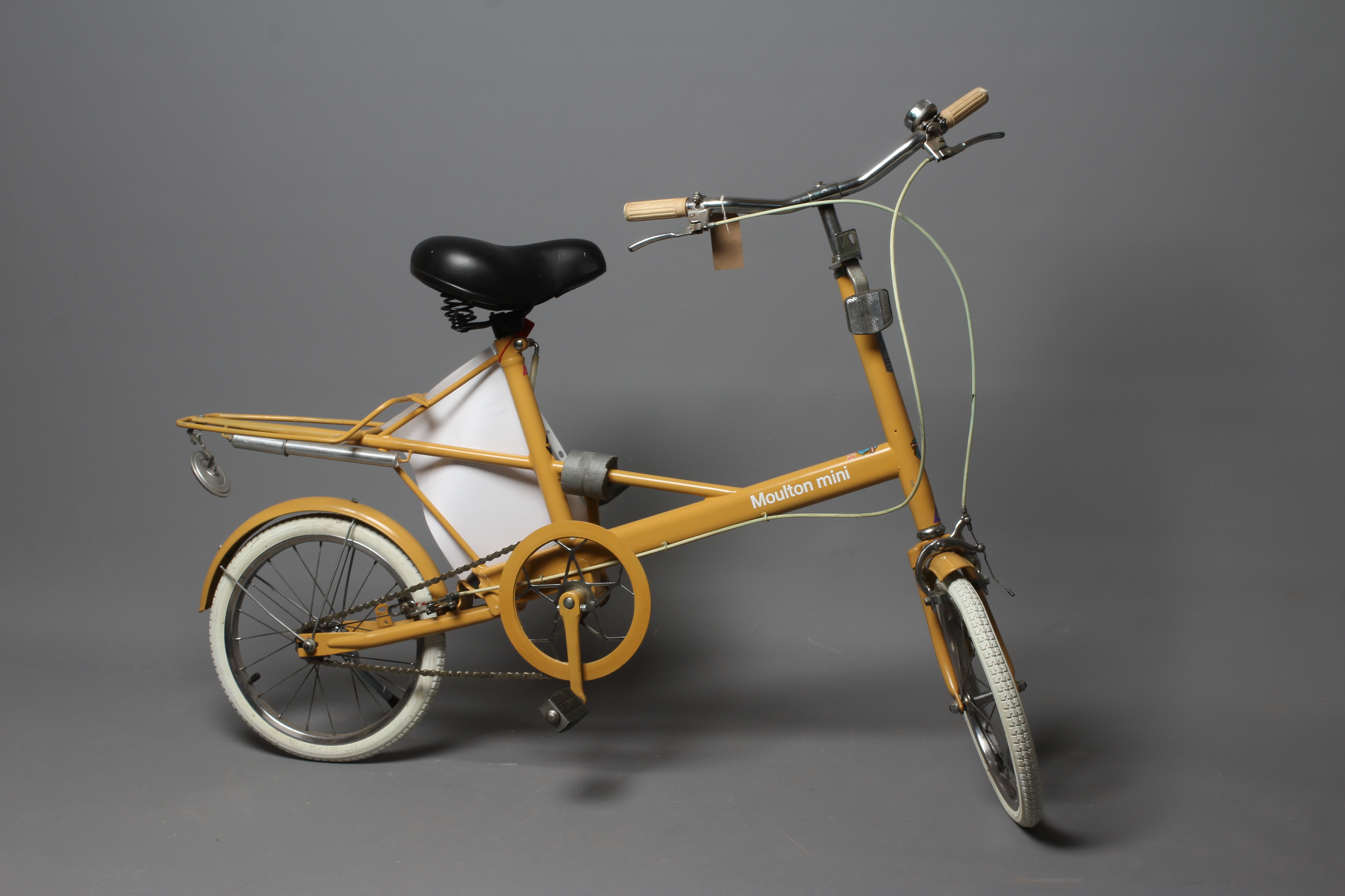 A Moulton Mini MKI shopper style unisex bike in brown, 14" wheels, with Alan Watson shop label, good Image