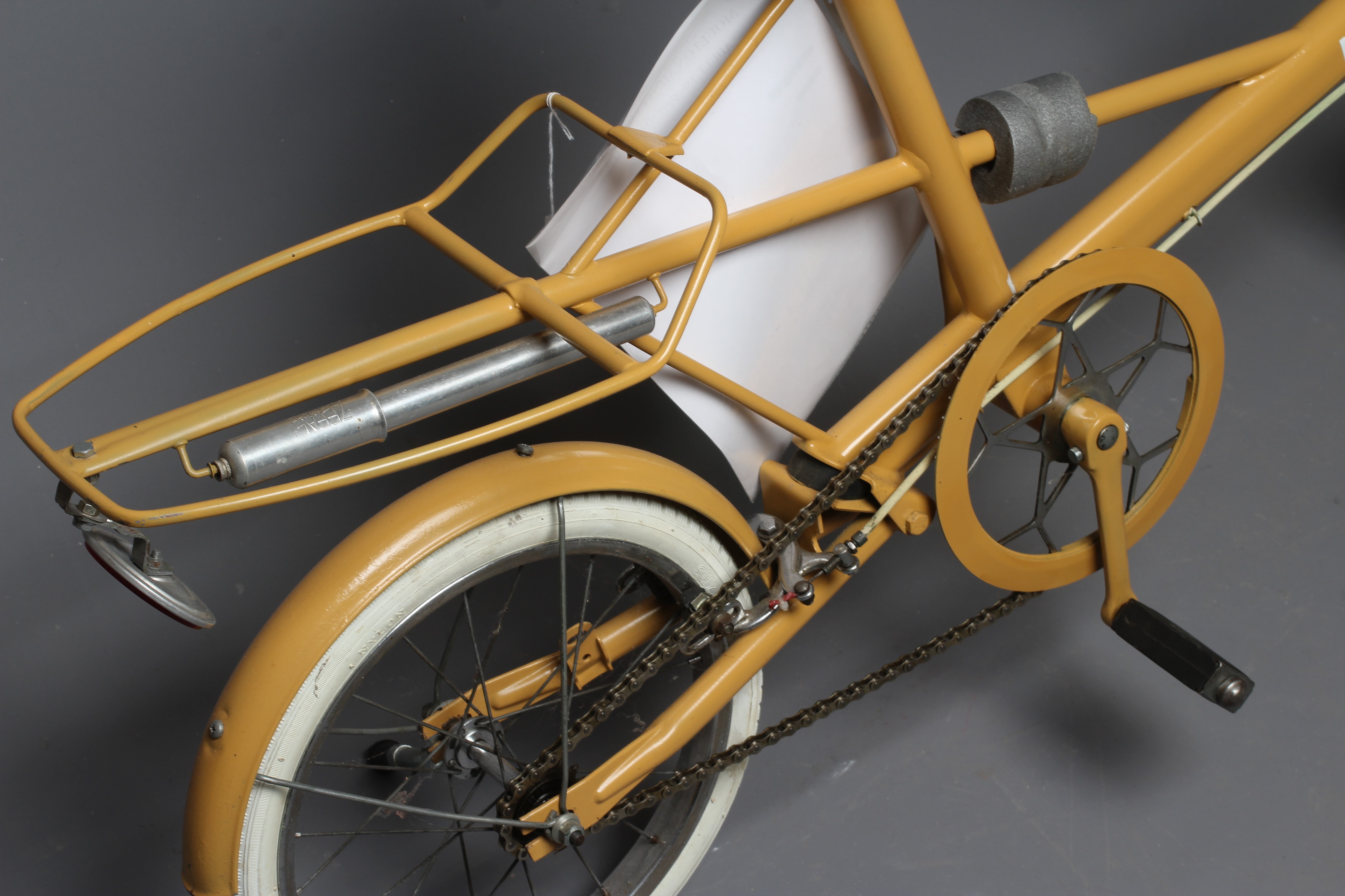 A Moulton Mini MKI shopper style unisex bike in brown, 14" wheels, with Alan Watson shop label, good Image