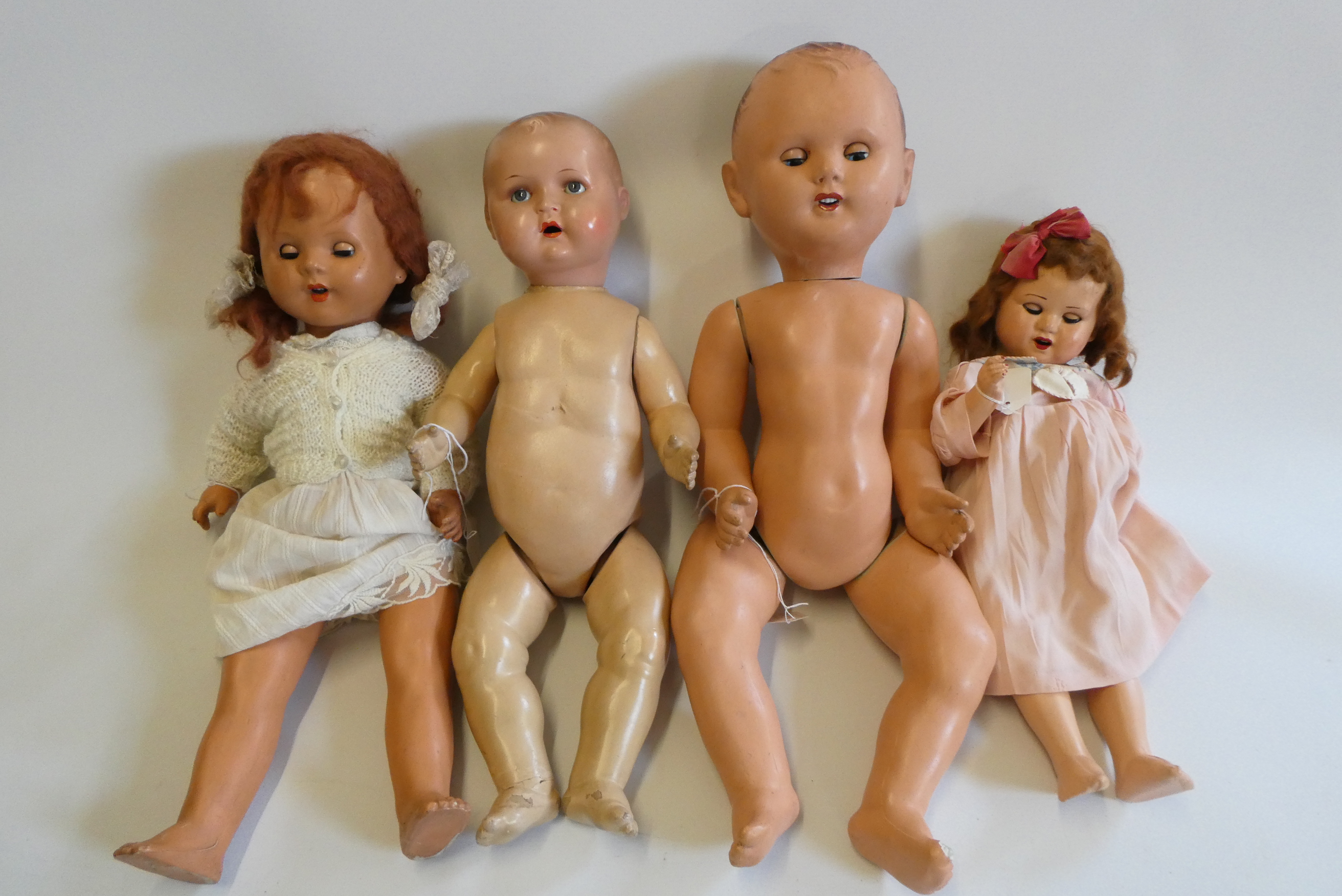 Four vintage dolls, comprising a 23" Frank Popper girl, a 27" Frank Popper boy, a 24" composition Image
