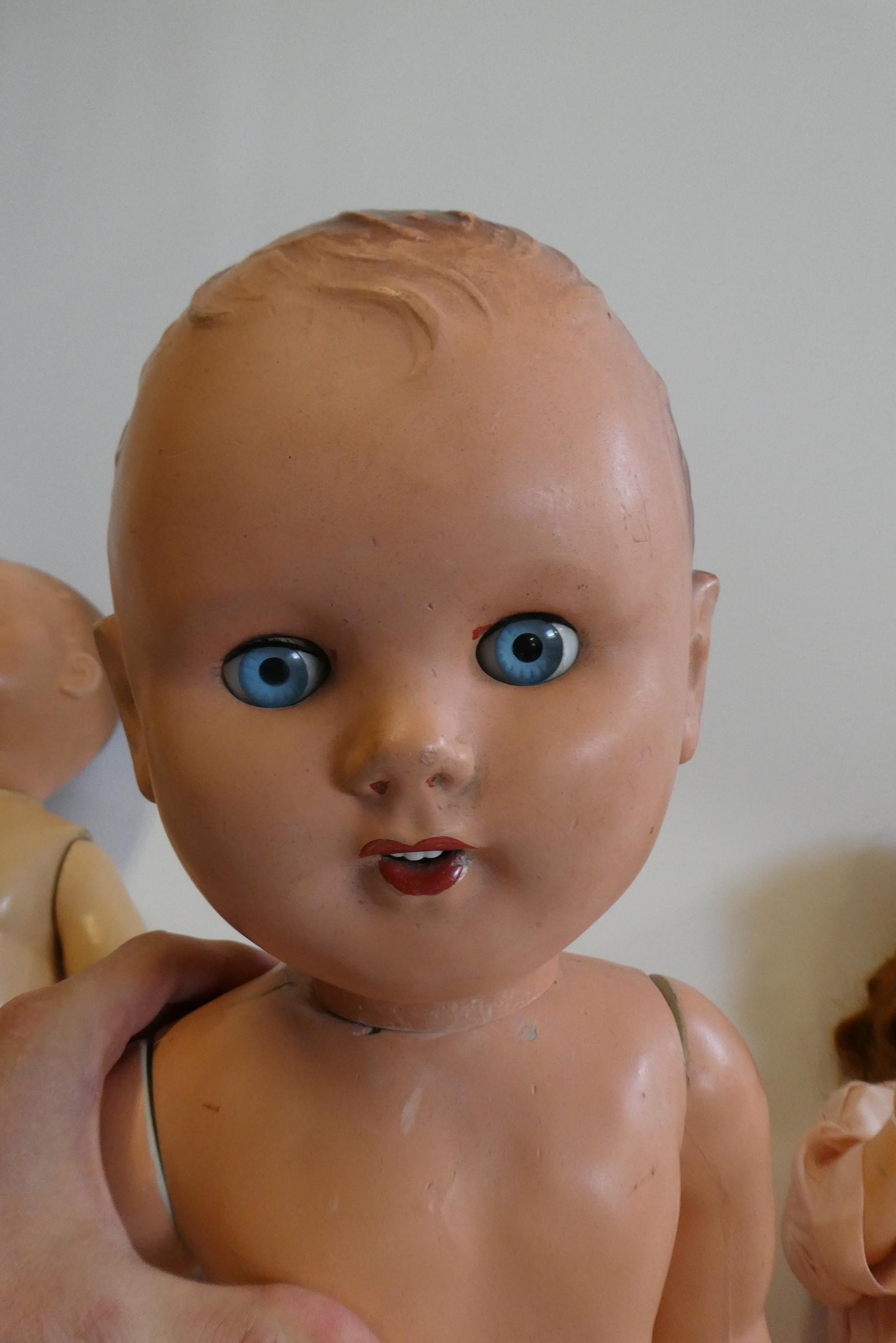 Four vintage dolls, comprising a 23" Frank Popper girl, a 27" Frank Popper boy, a 24" composition Image