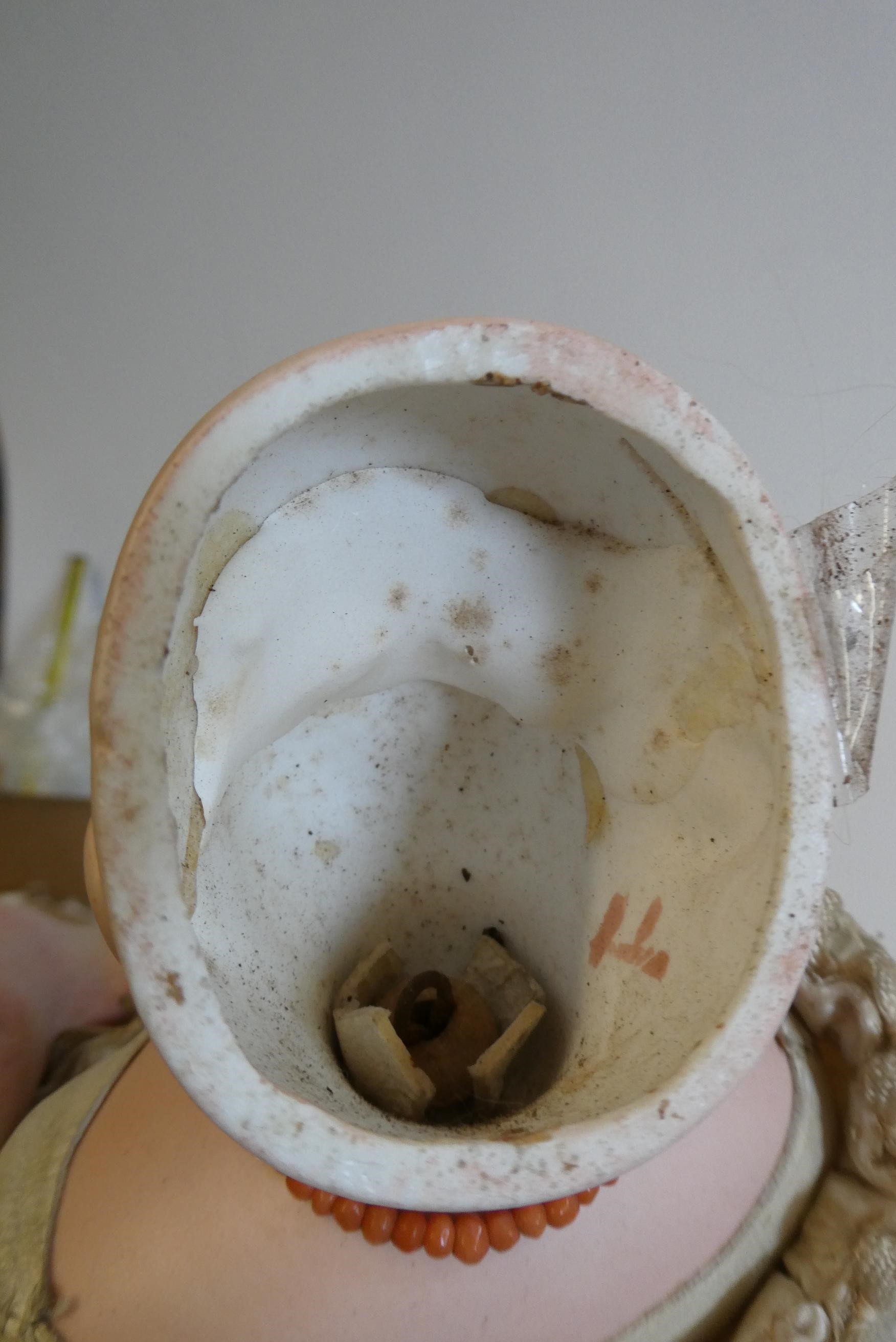 A Jumeau bisque shoulder head doll with blue glass fixed eyes Image