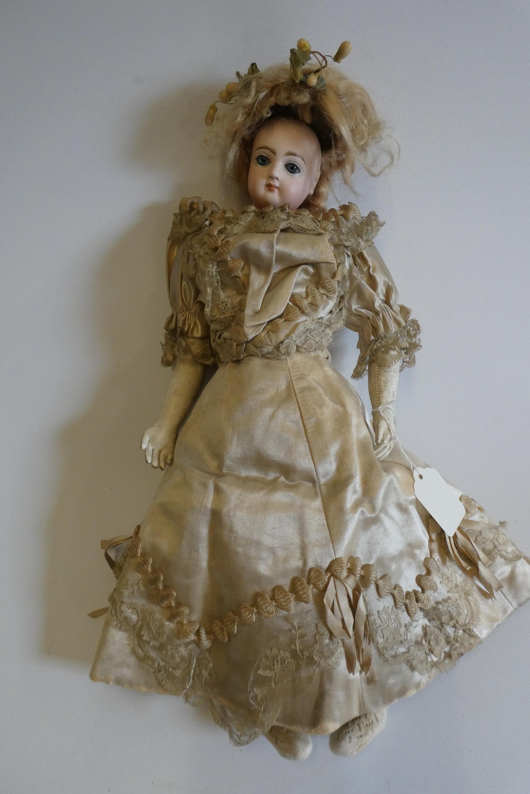 A Jumeau bisque shoulder head doll with blue glass fixed eyes Image