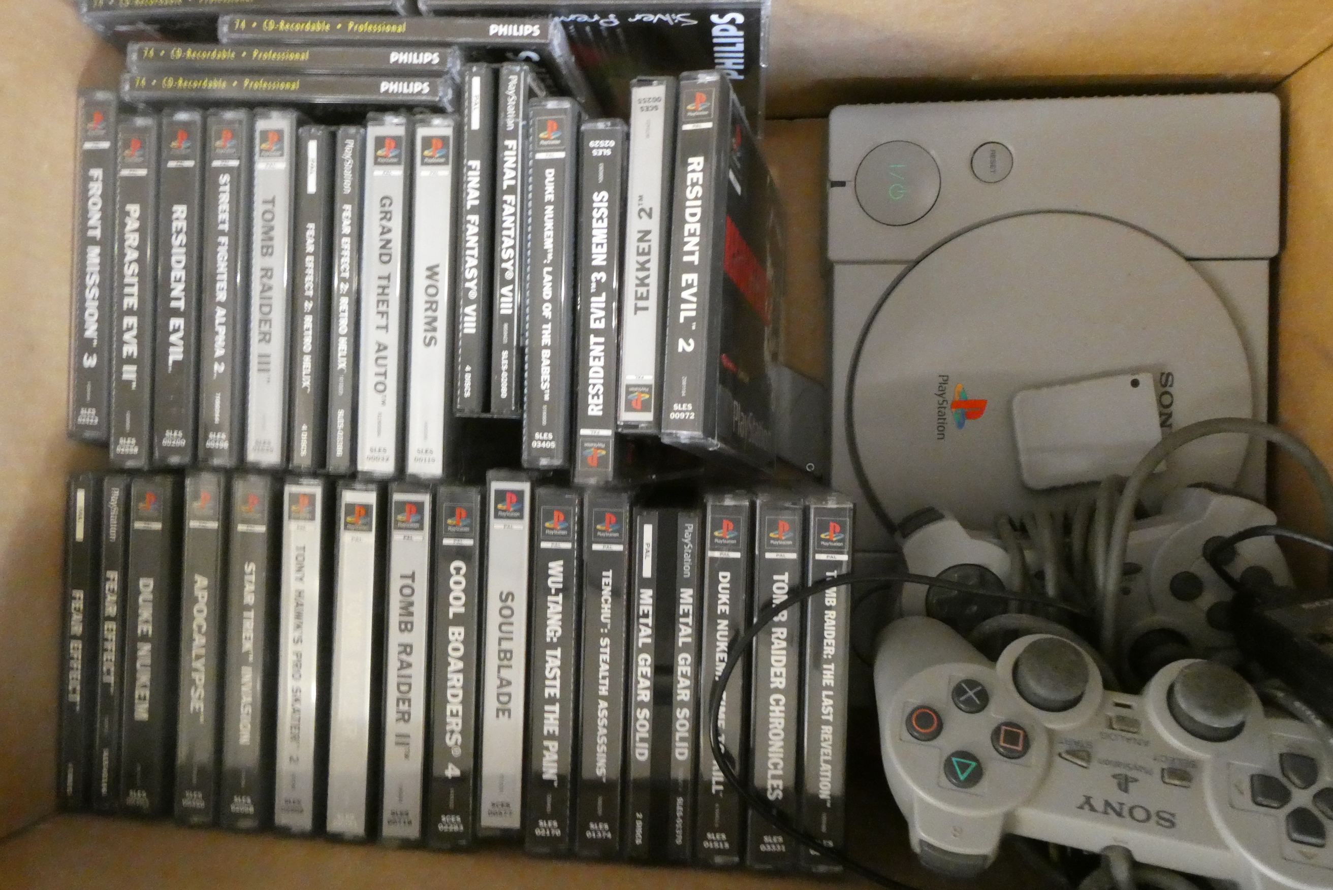 Playstation with controllers and 28 boxed games Image