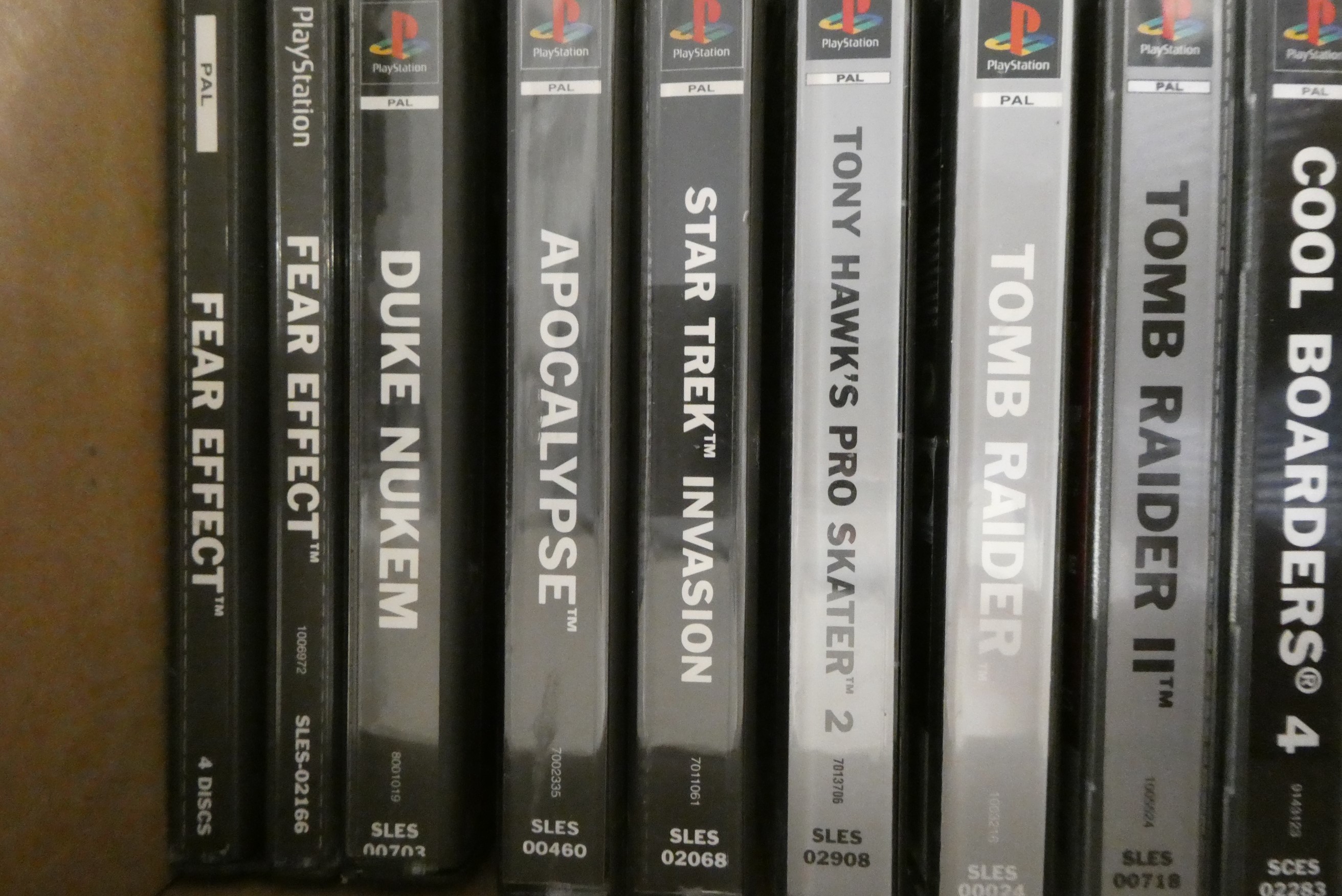 Playstation with controllers and 28 boxed games Image