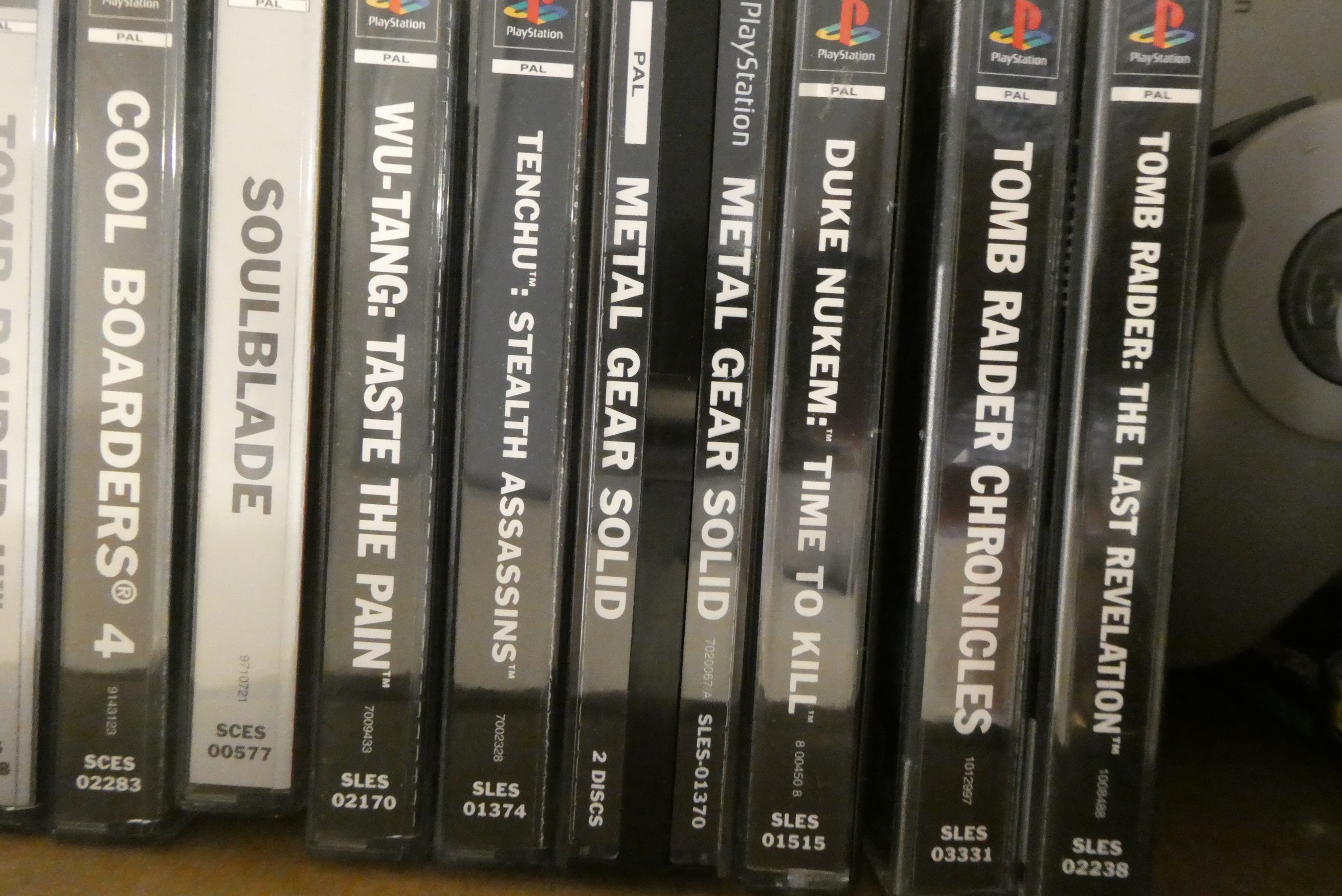 Playstation with controllers and 28 boxed games Image