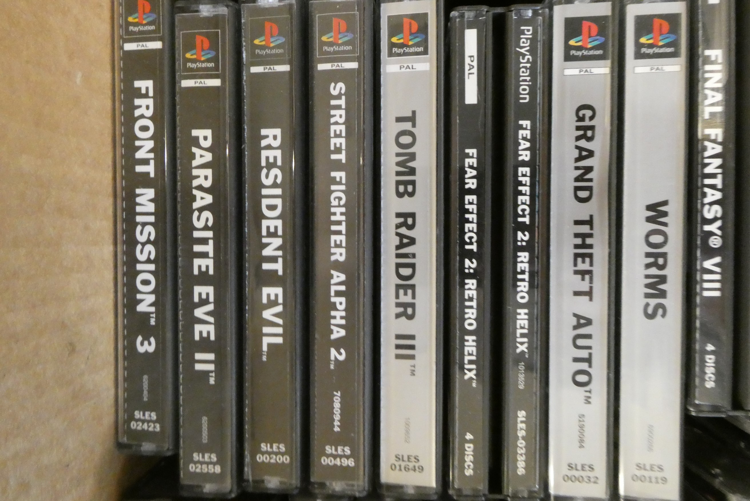 Playstation with controllers and 28 boxed games Image