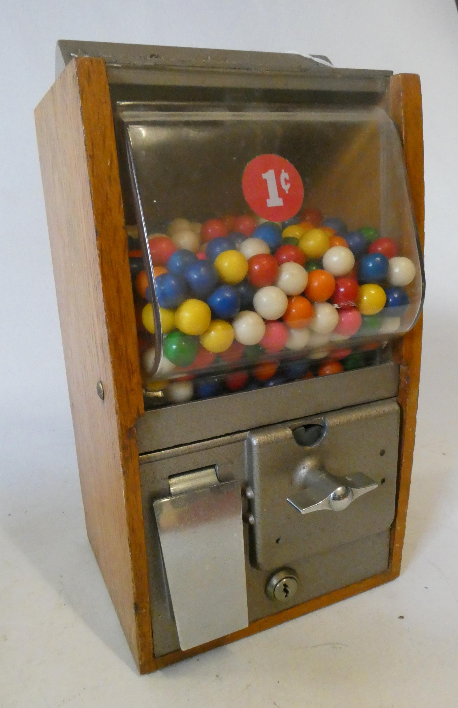 An ACB gum ball machine, of wood and metal construction, with 1c pricing, some wear, unable to check Image