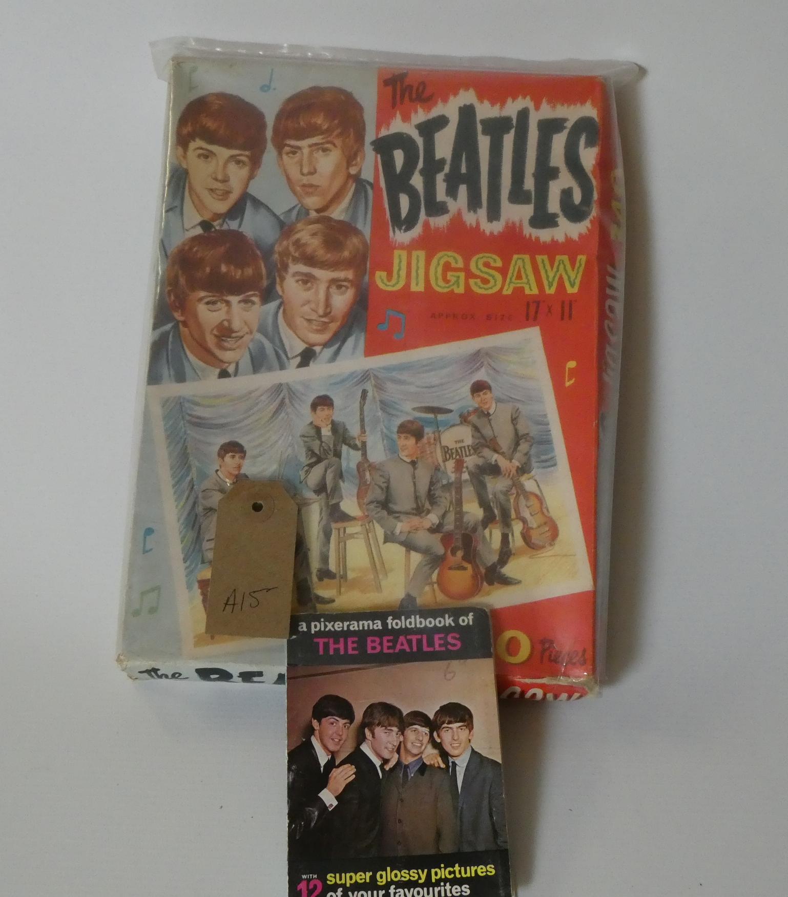 The Beatles jigsaw puzzle, unchecked for completeness, and The Beatles picture book, good (Est. plus Image