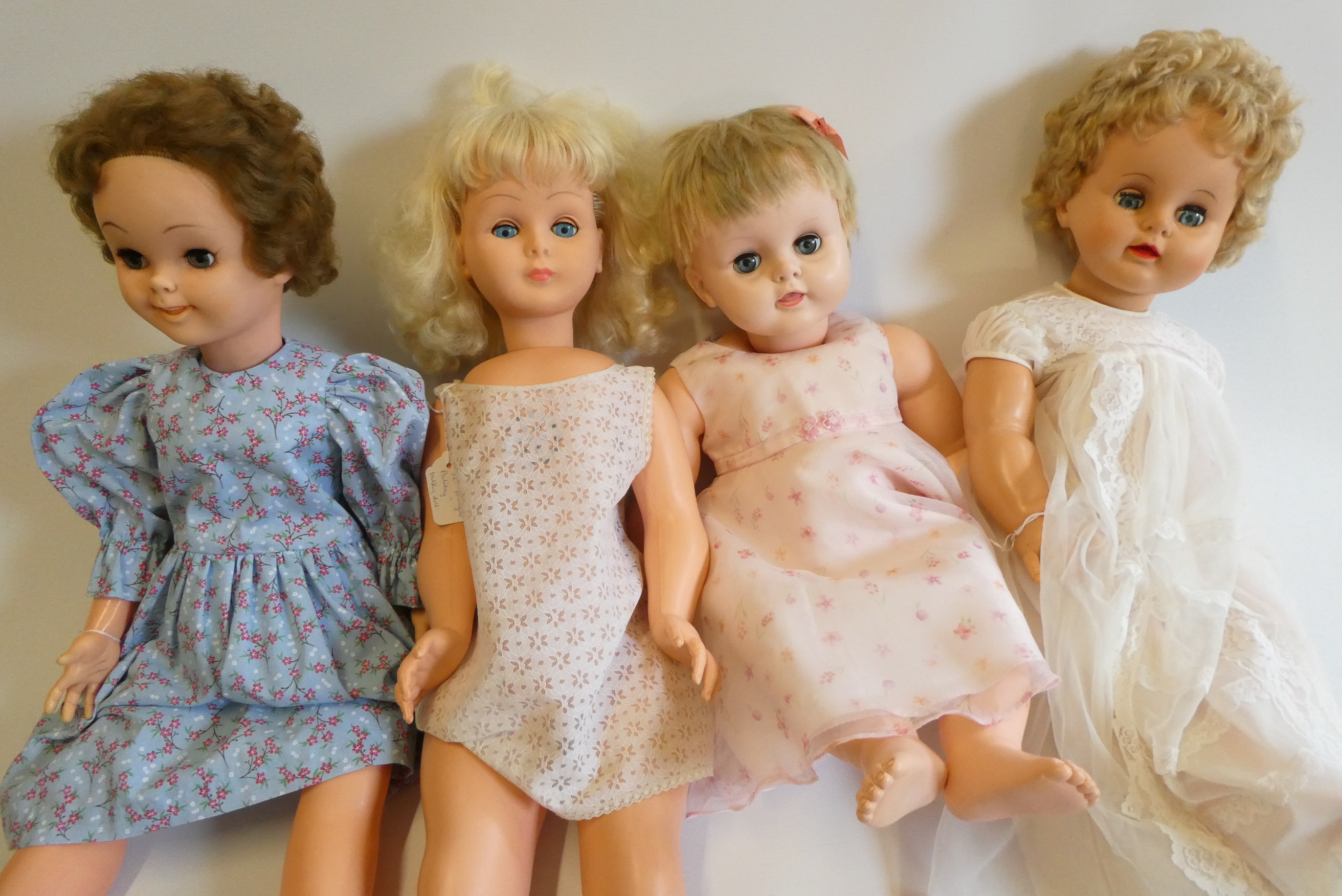 Four vintage vinyl dolls, comprising a 30" Disney Pollyanna, two 28" Rosebud Mannequin dolls, and a Image
