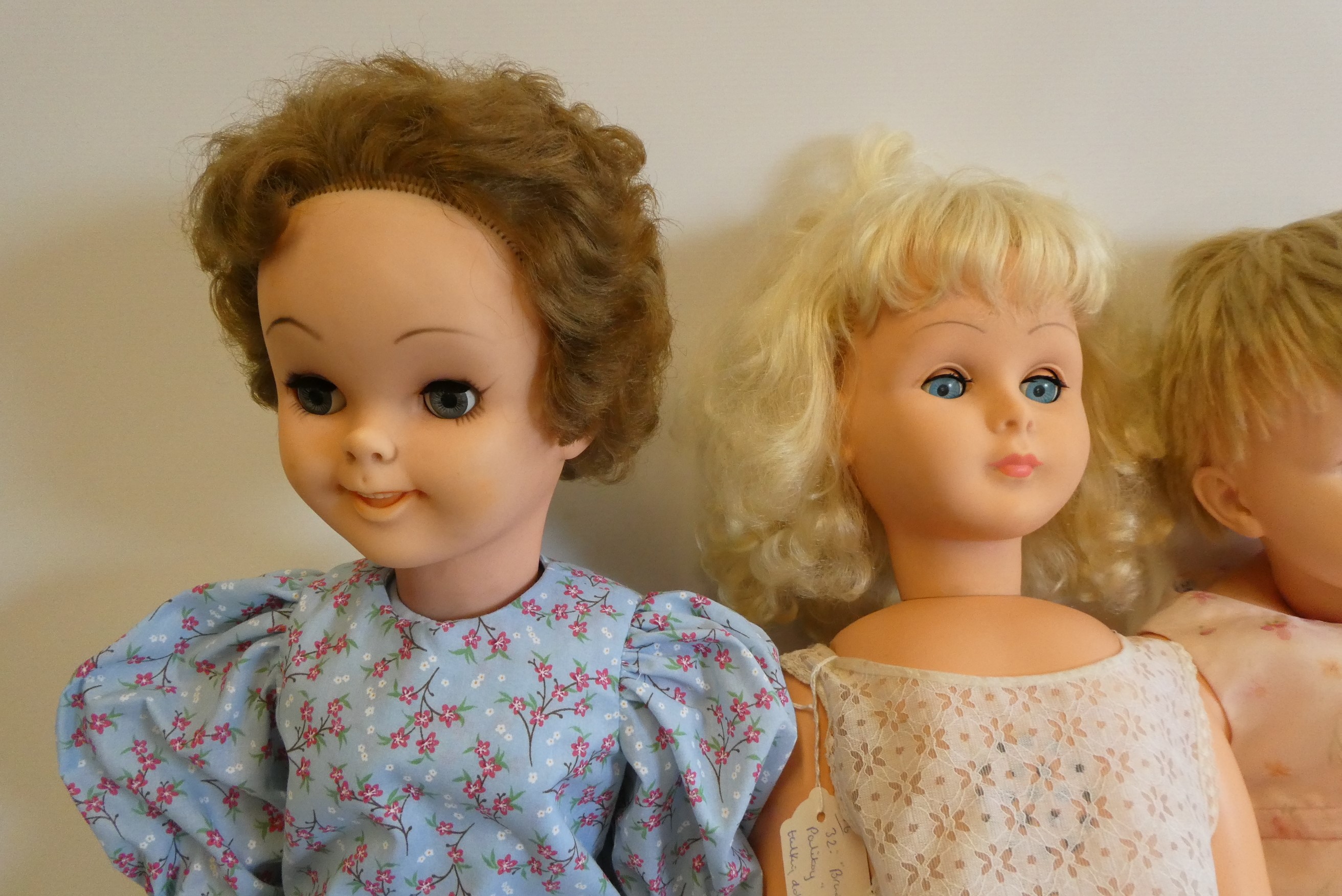 Four vintage vinyl dolls, comprising a 30" Disney Pollyanna, two 28" Rosebud Mannequin dolls, and a Image