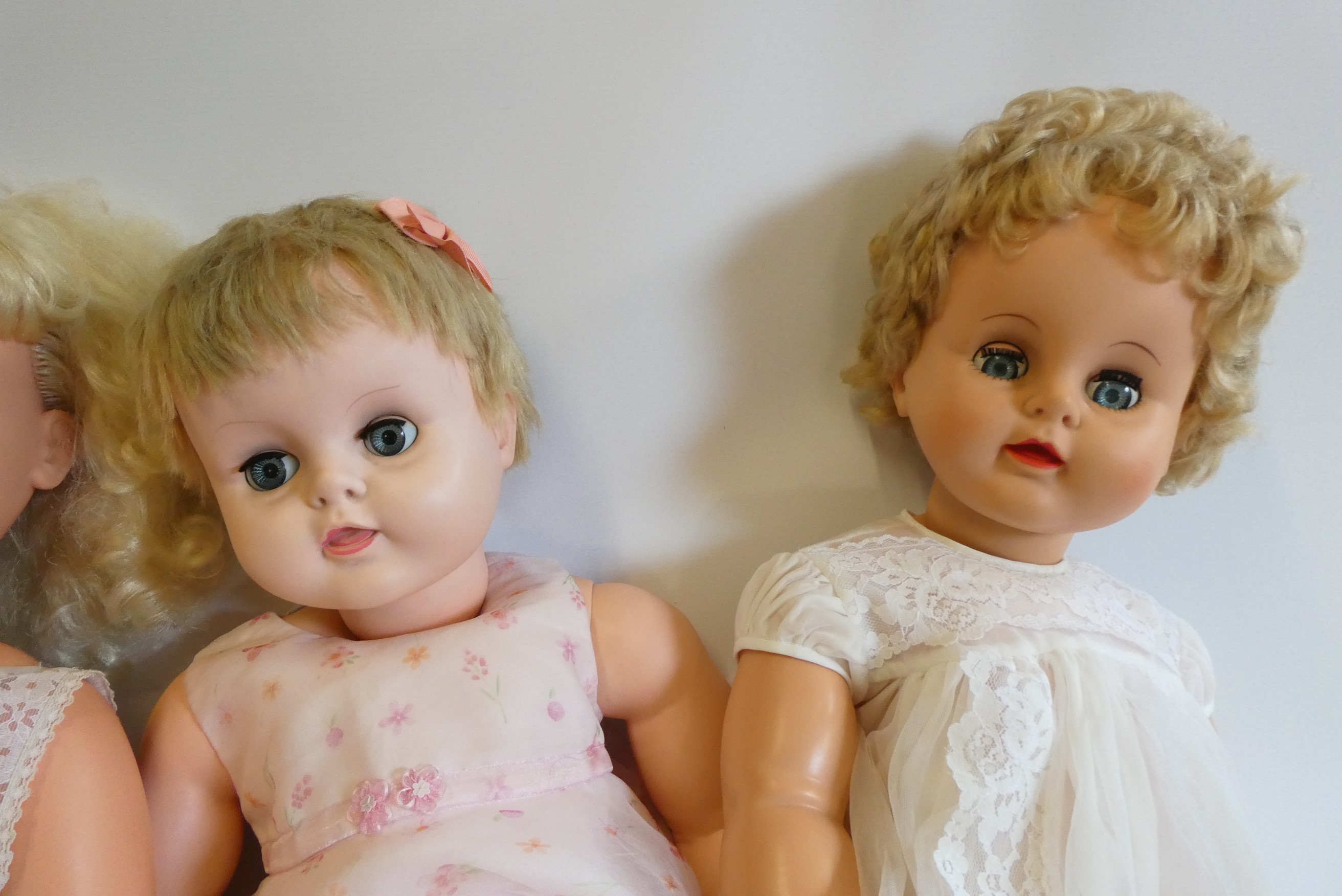 Four vintage vinyl dolls, comprising a 30" Disney Pollyanna, two 28" Rosebud Mannequin dolls, and a Image