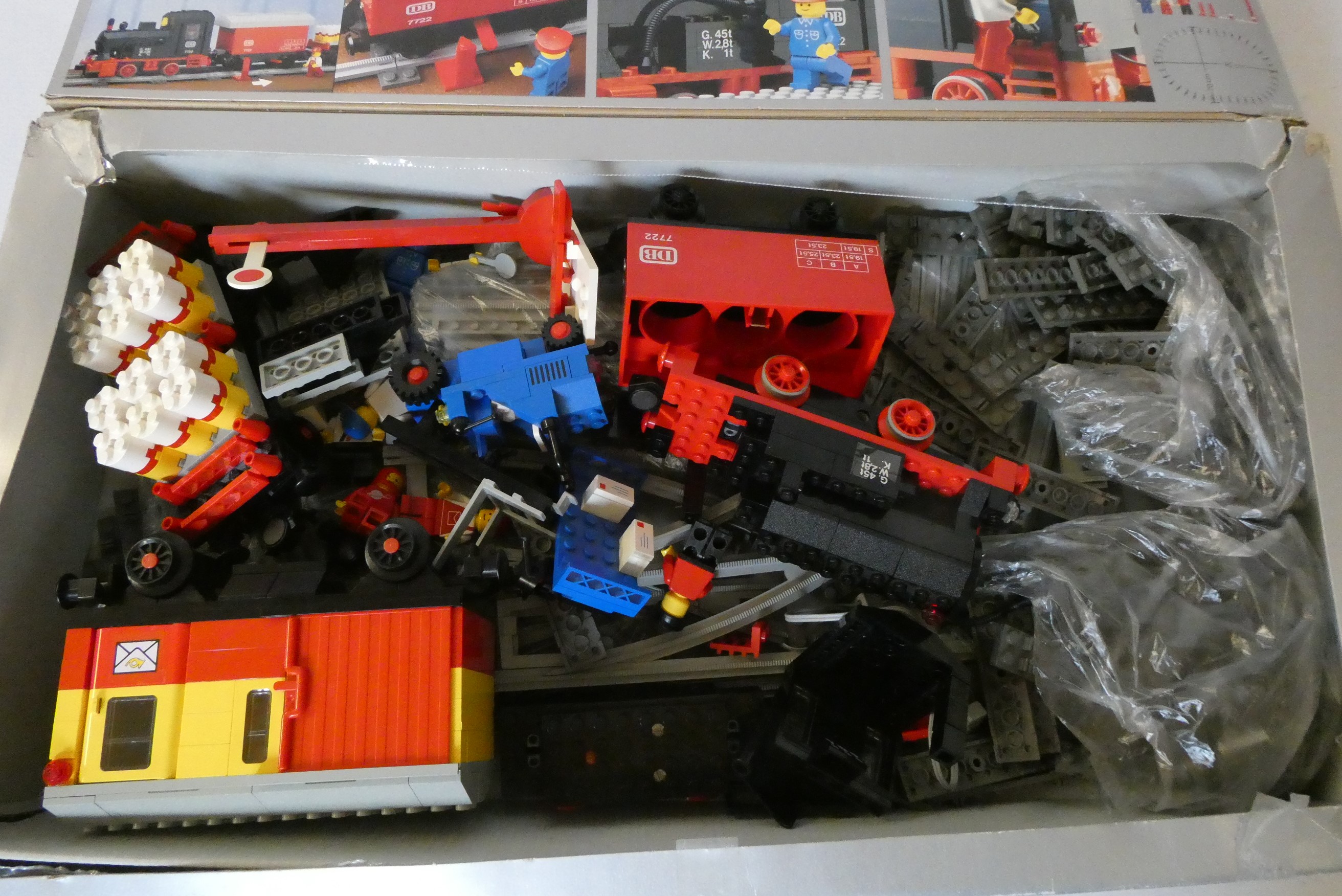 Lego 7722 unboxed railway models including battery locomotives, coaches, wagons and track parts Image