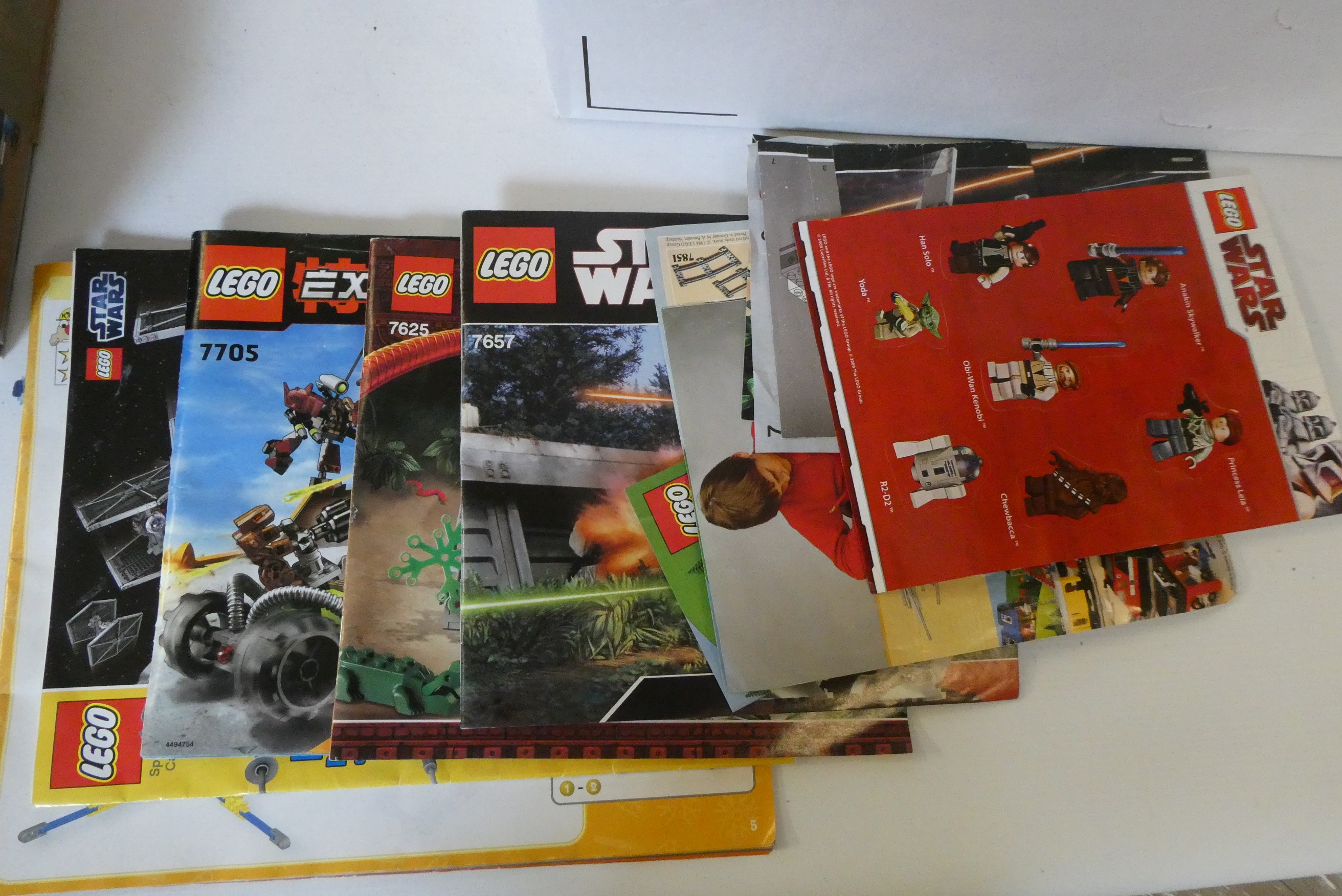 Lego 7722 unboxed railway models including battery locomotives, coaches, wagons and track parts Image