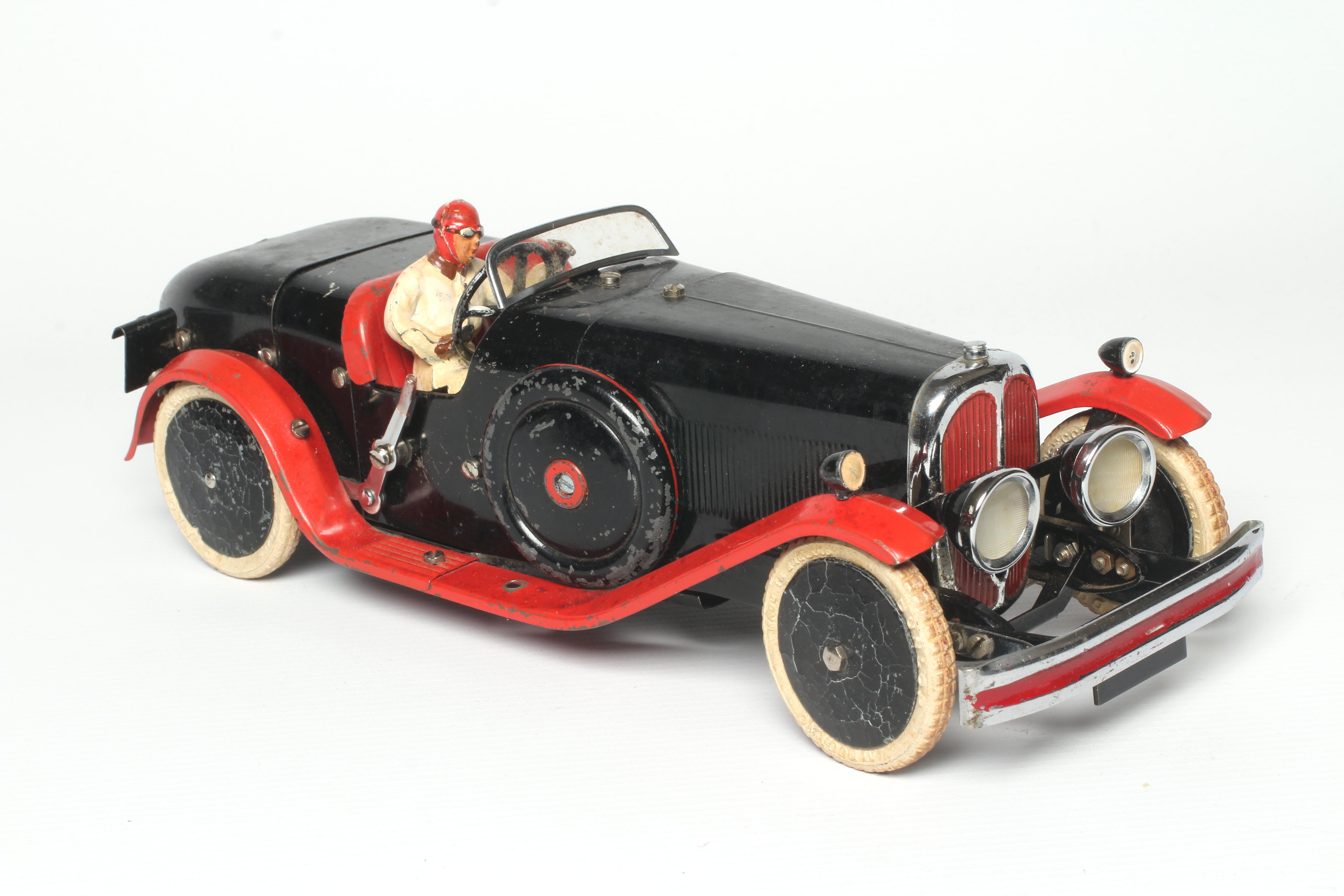 Meccano constructor car finished in red and black with driver, clockwork motor tested OK, some Image