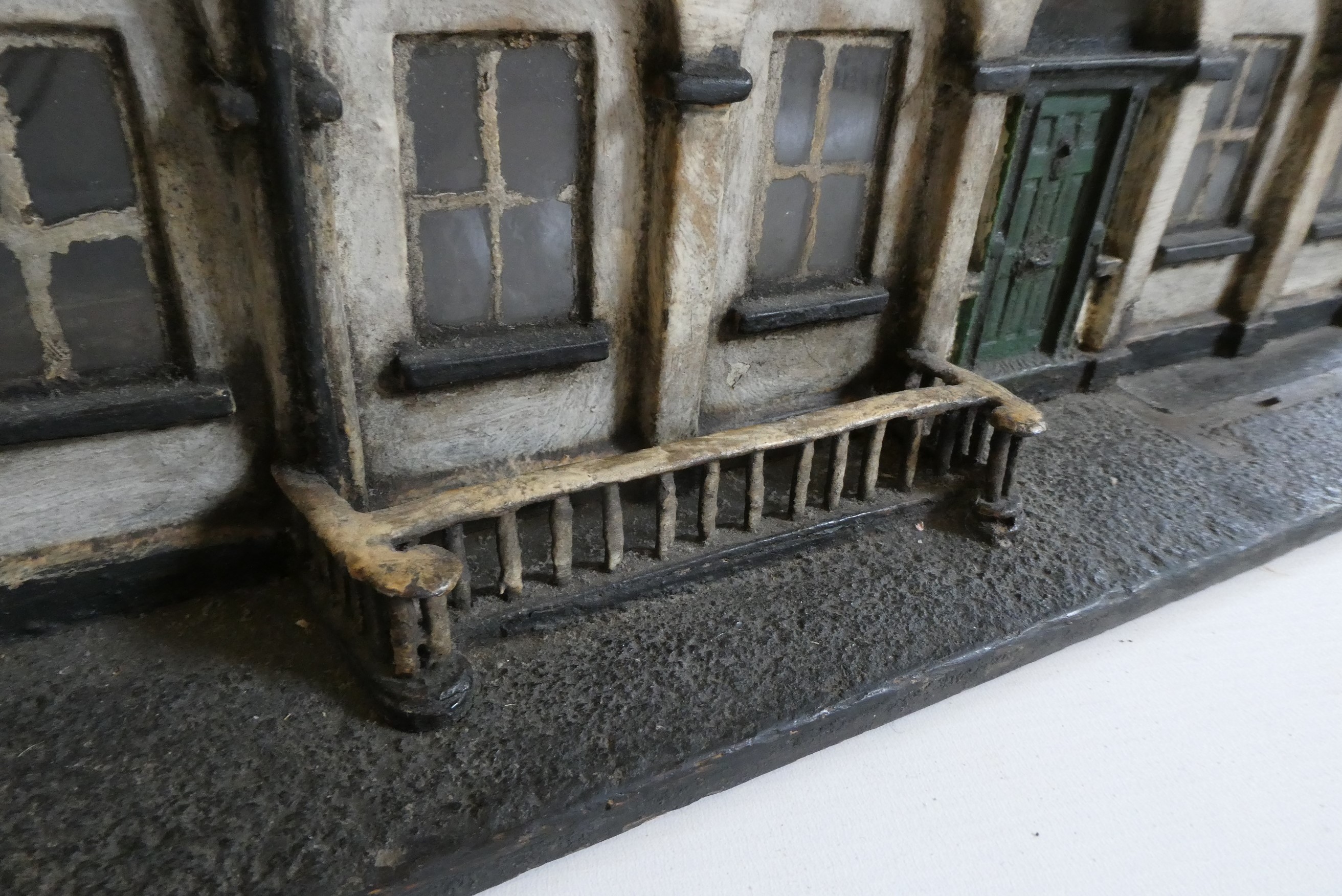 A Victorian doll's house/trunk in the form of a two house street Image