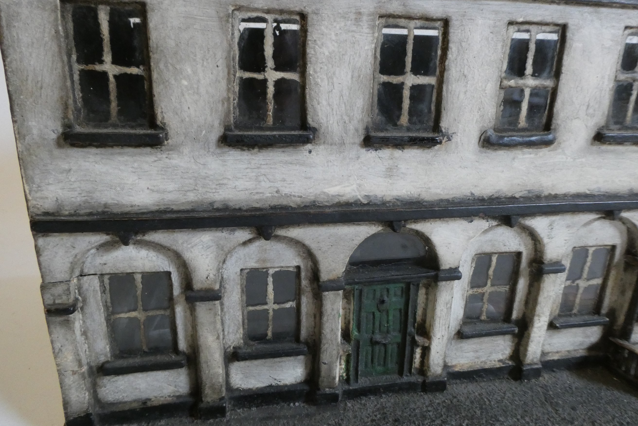 A Victorian doll's house/trunk in the form of a two house street Image