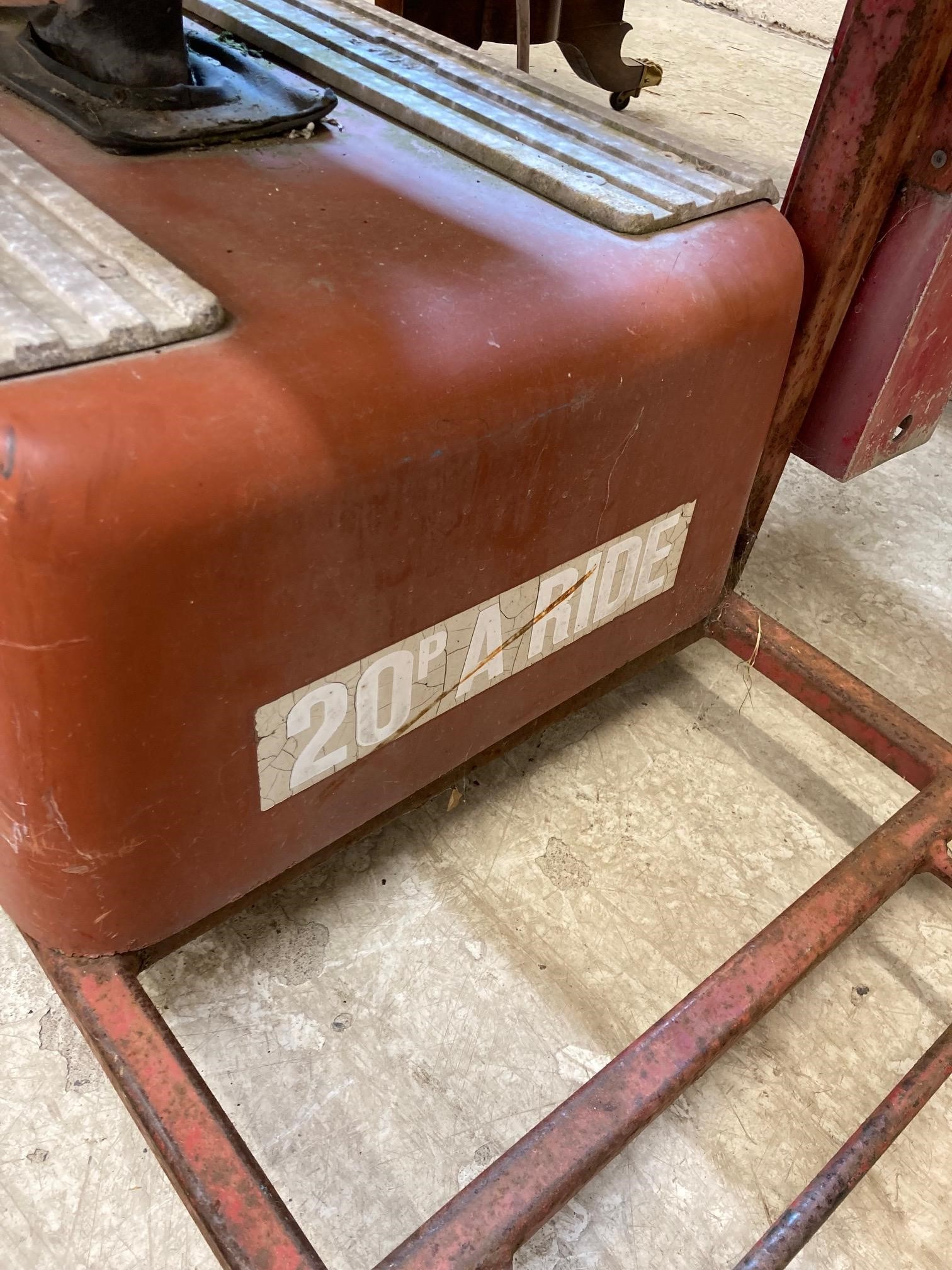 A child's ride on rocket ship Image