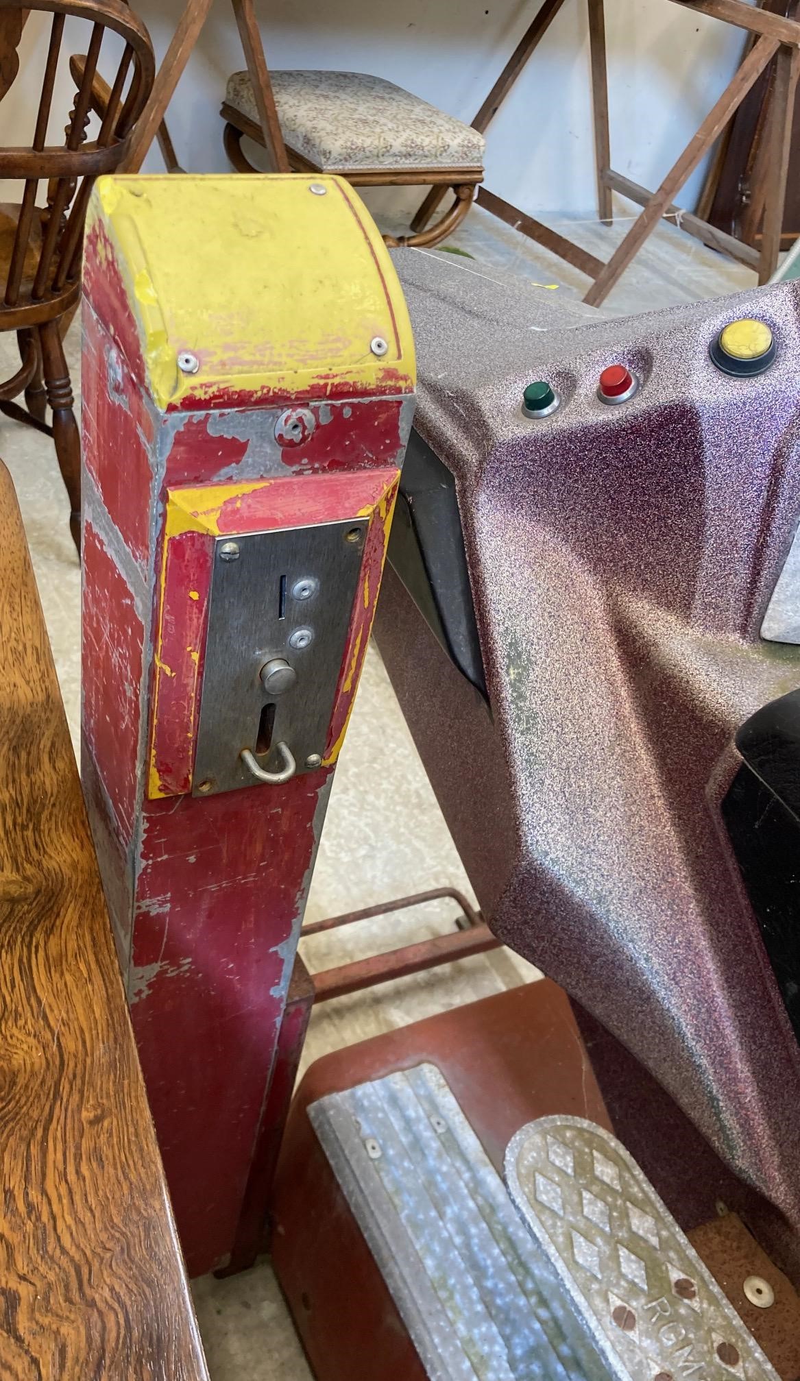 A child's ride on rocket ship Image