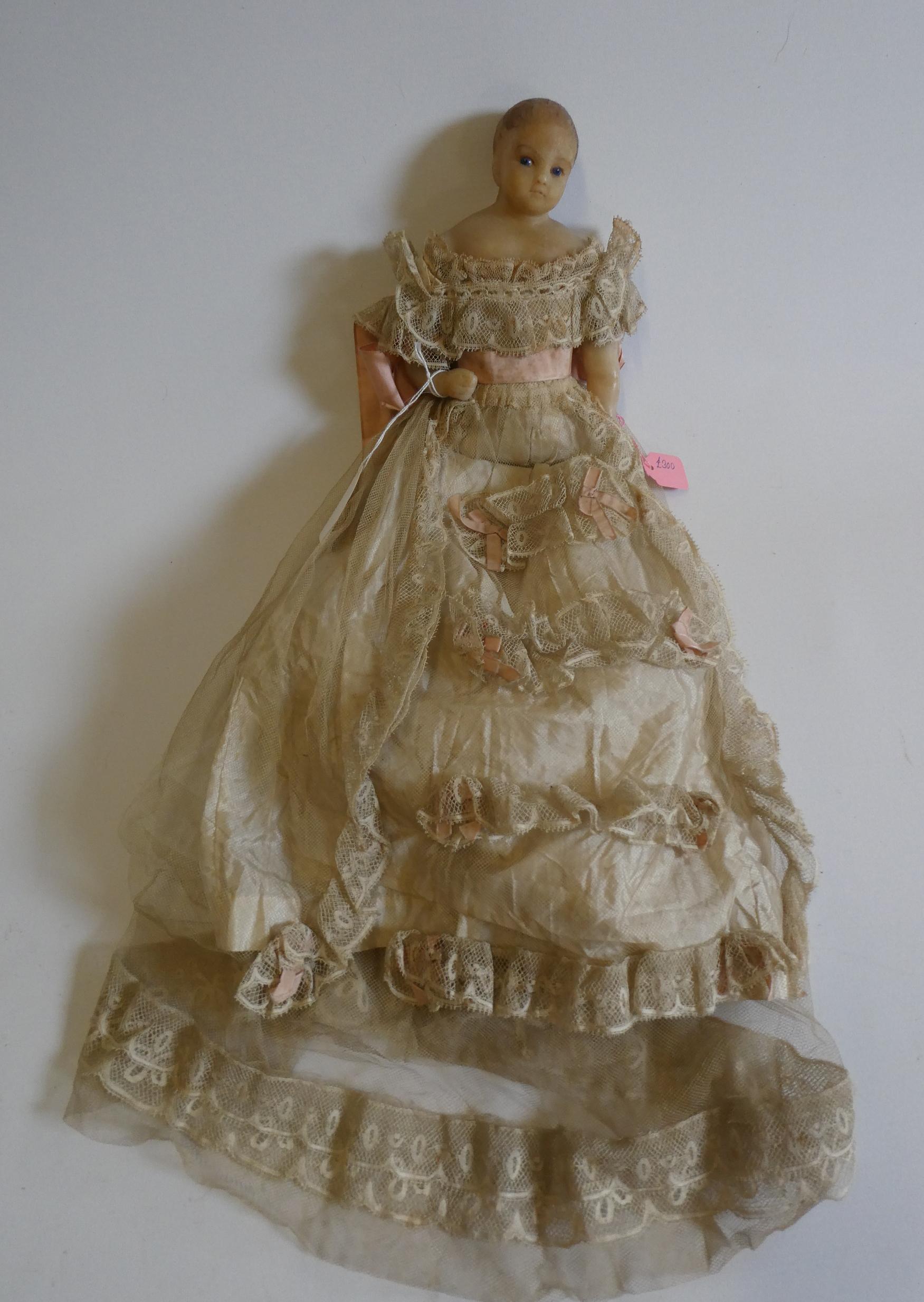 A poured wax shoulder head doll Image