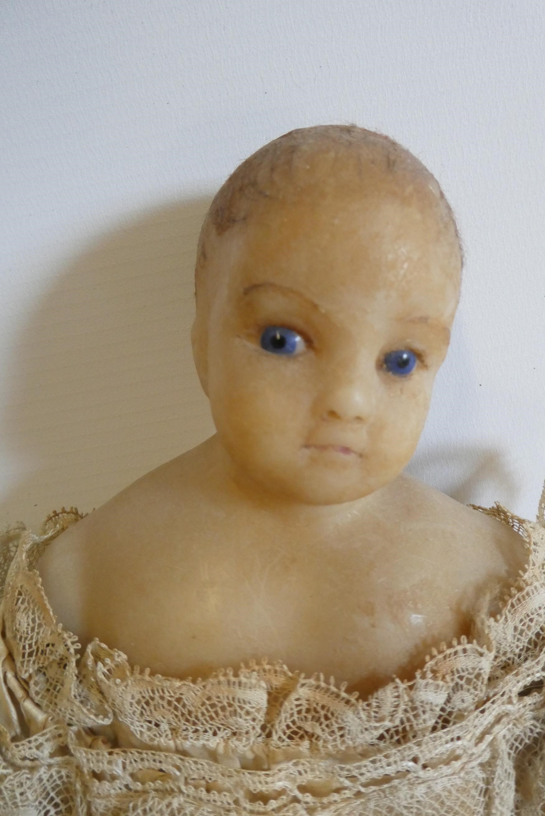 A poured wax shoulder head doll Image
