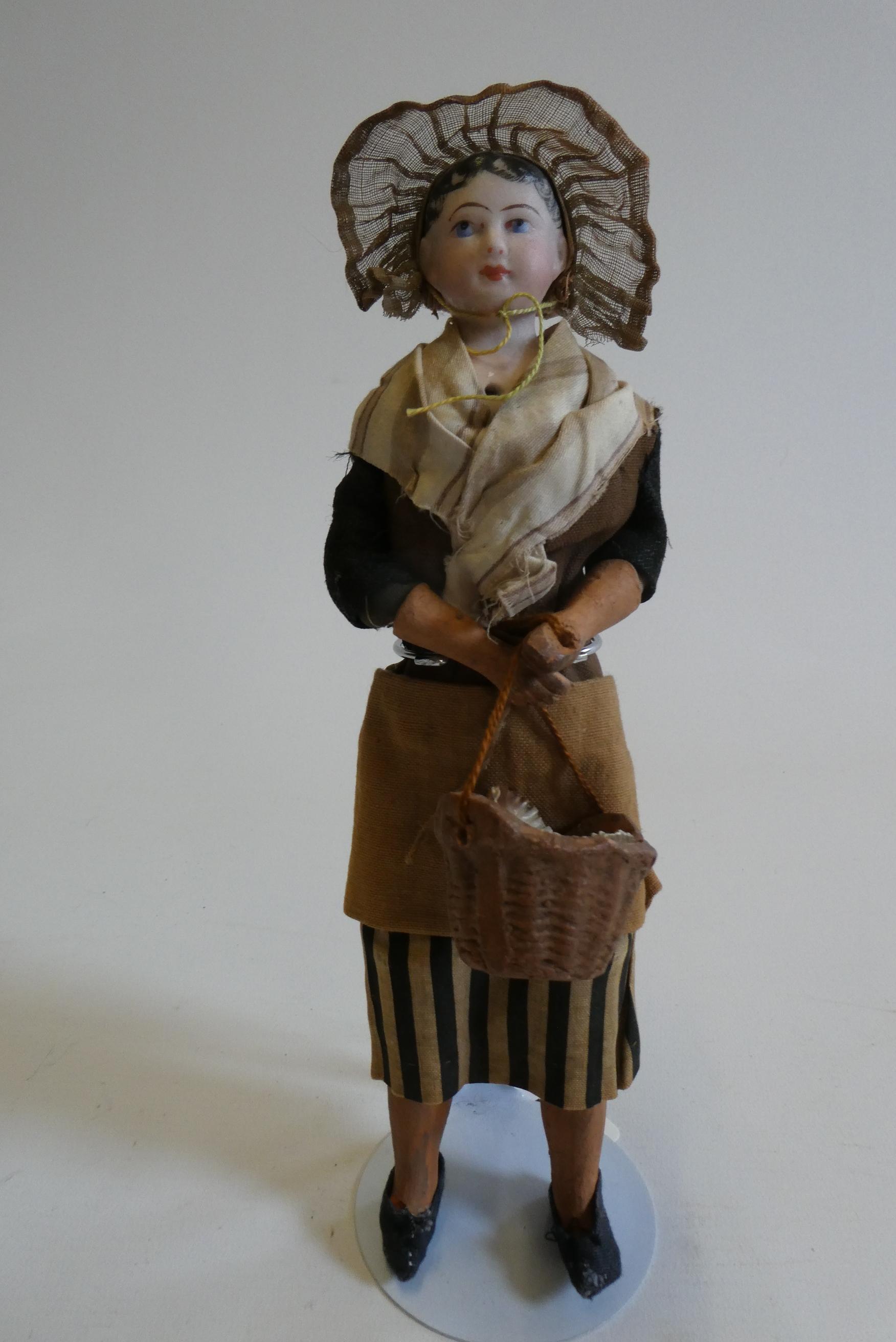 A possibly Francois Gaultier fisherwoman bisque shoulder head doll with blue moulded eyes Image