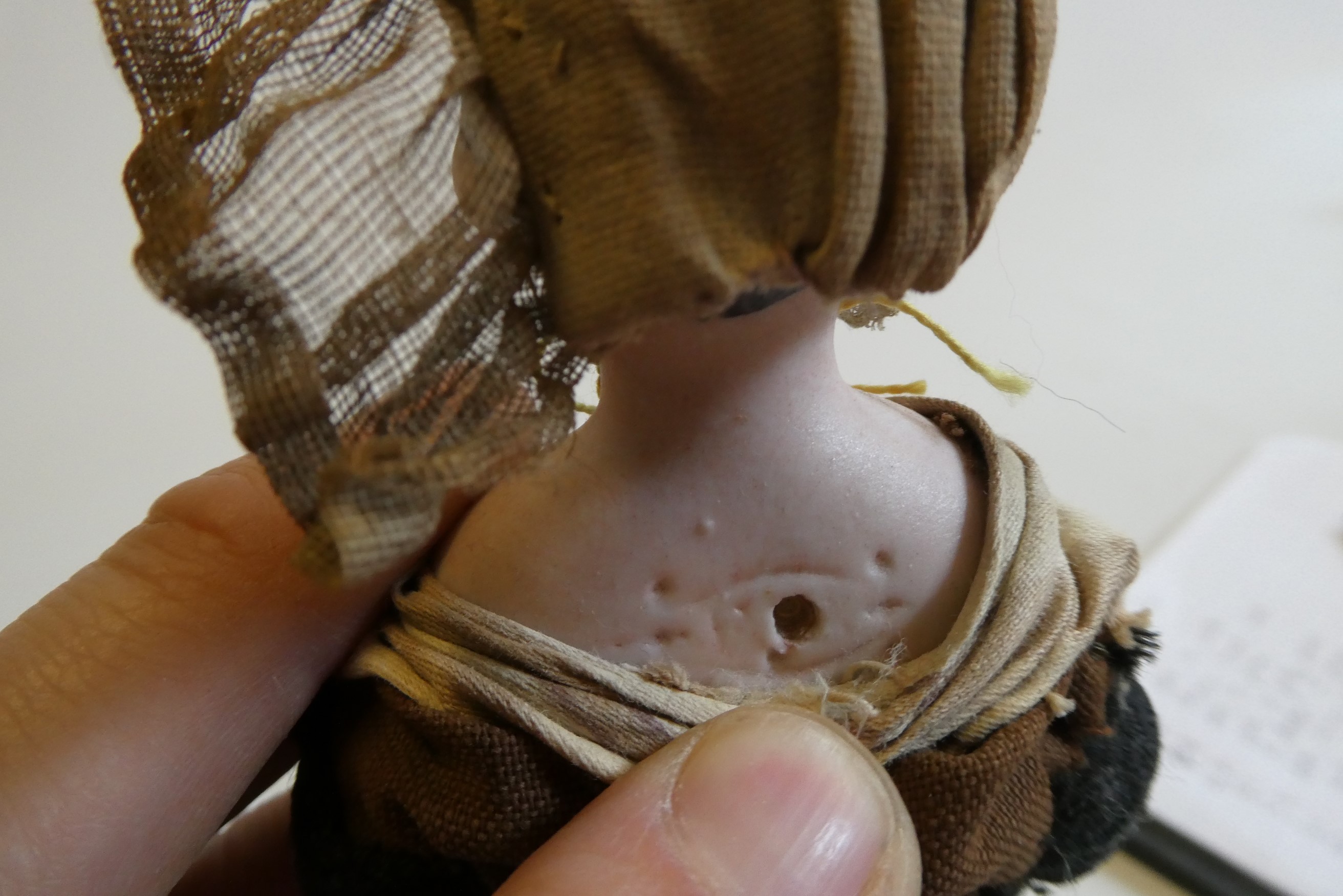 A possibly Francois Gaultier fisherwoman bisque shoulder head doll with blue moulded eyes Image