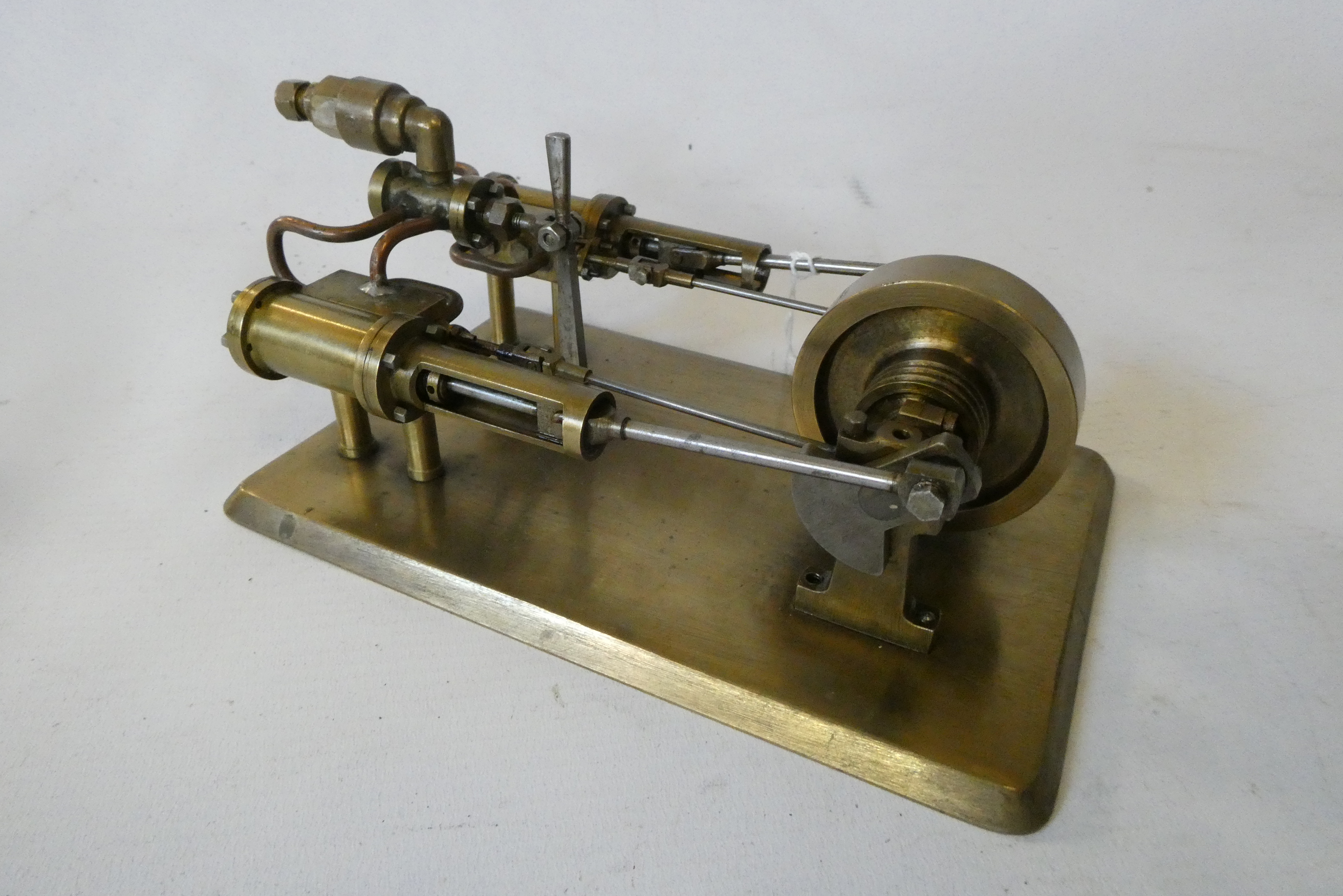 A twin cylinder horizontal steam engine built from brass fabrication, fitted with reversing valve on Image