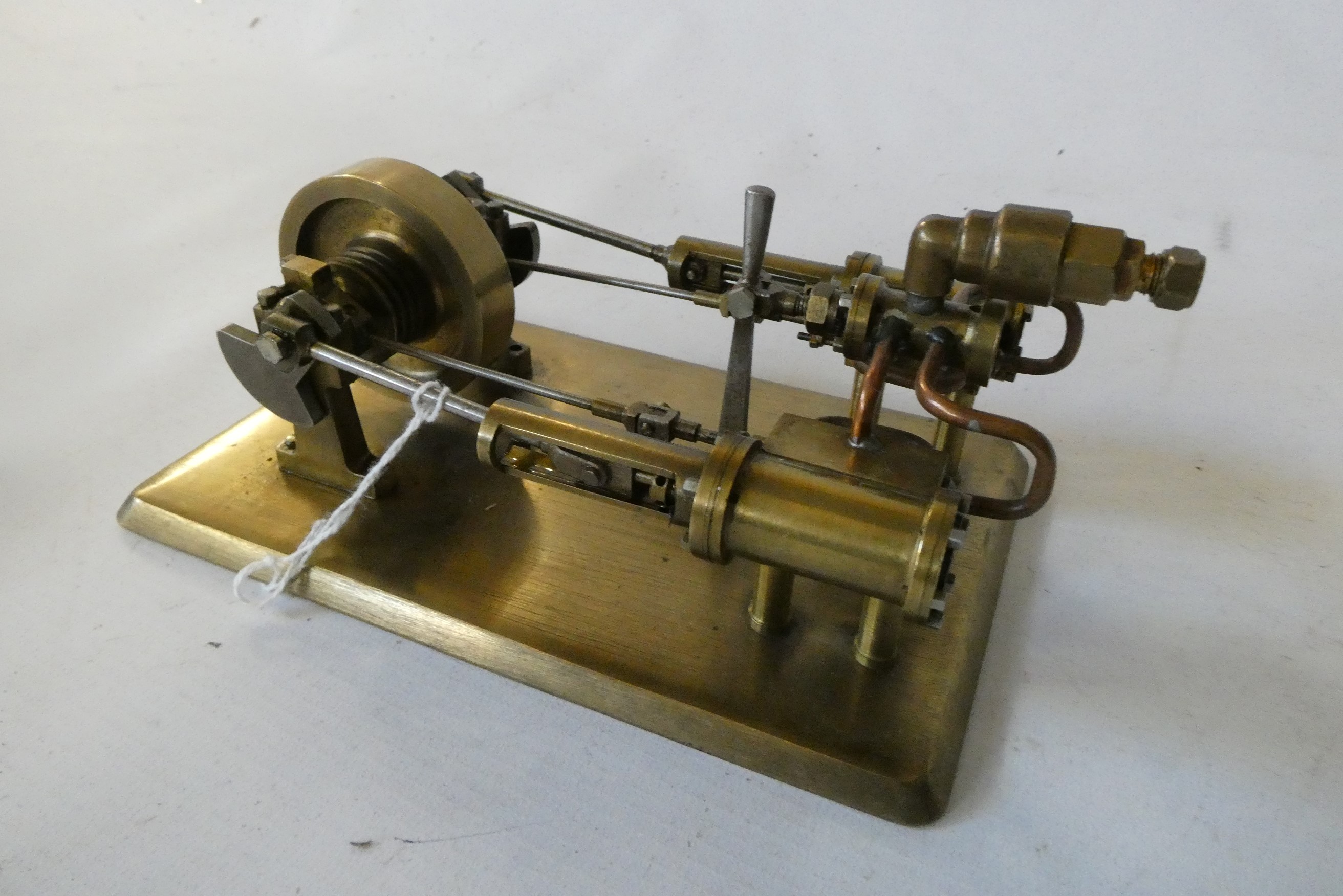 A twin cylinder horizontal steam engine built from brass fabrication, fitted with reversing valve on Image